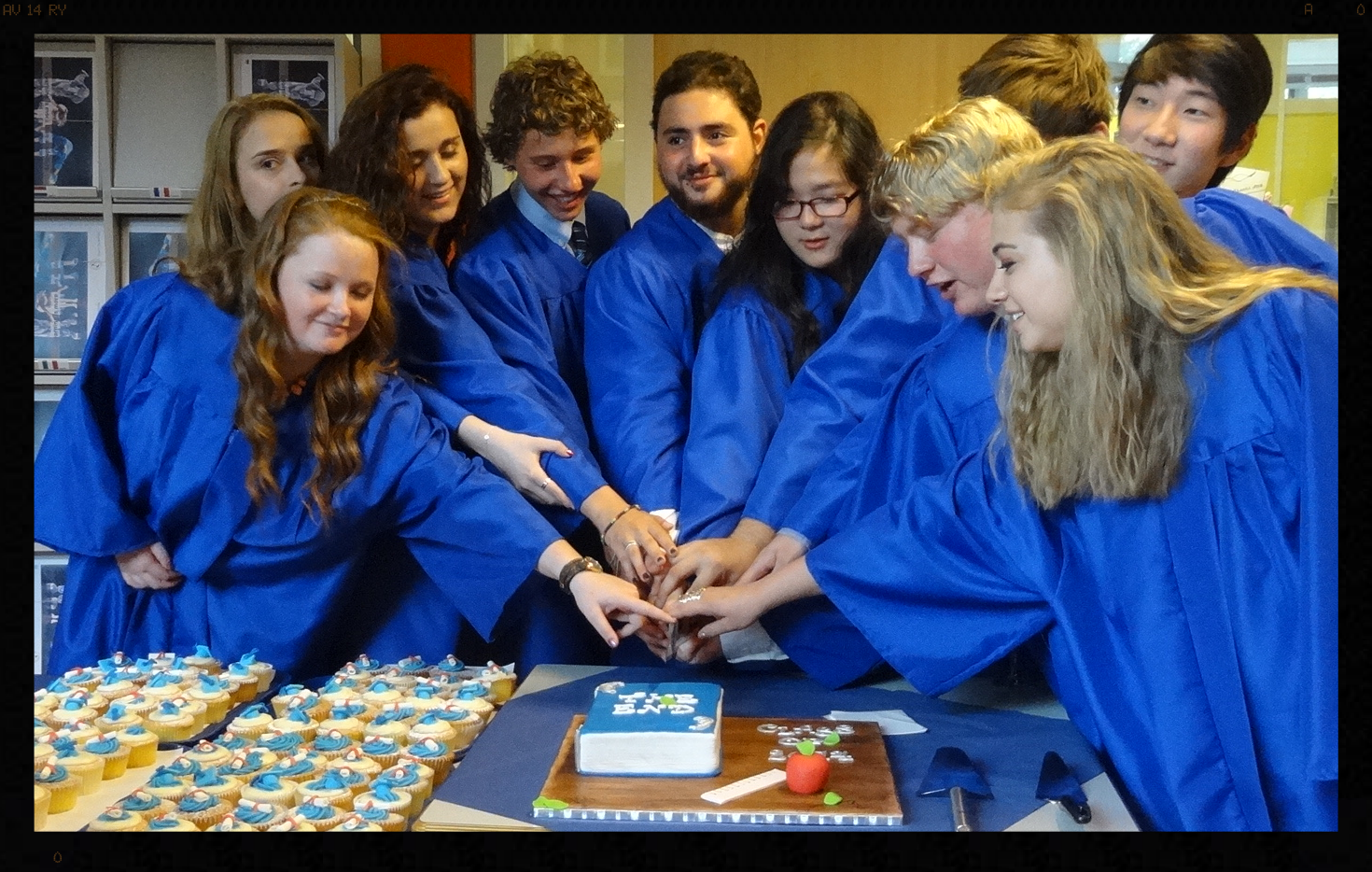 The seniors preparing to cut the cake.