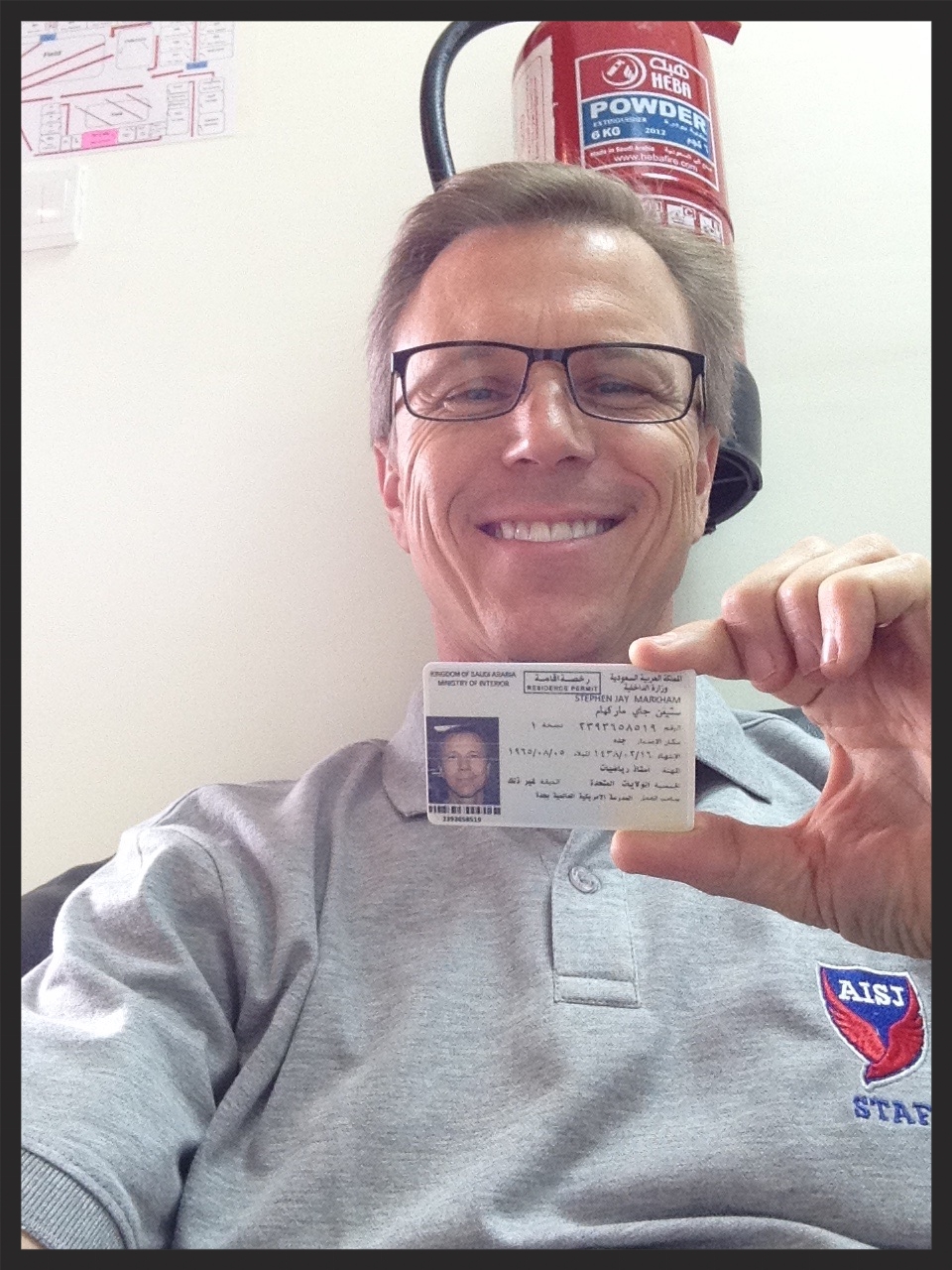 My husband, in Saudi Arabia, with his Iqama. The aquisition of this document is a significant step in getting us there.