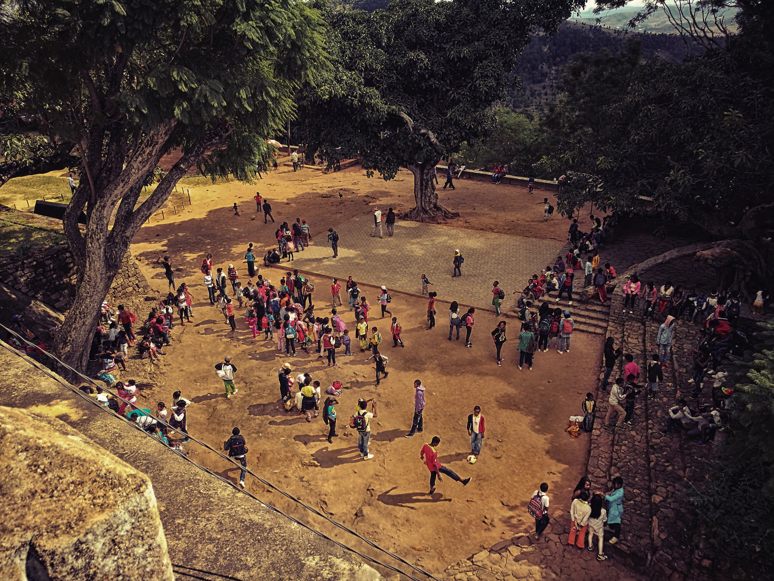 Break Time A nearby school uses the ancient palace courtyard as a place for children to enjoy their break from class. Football and marbles are the rule of the day.