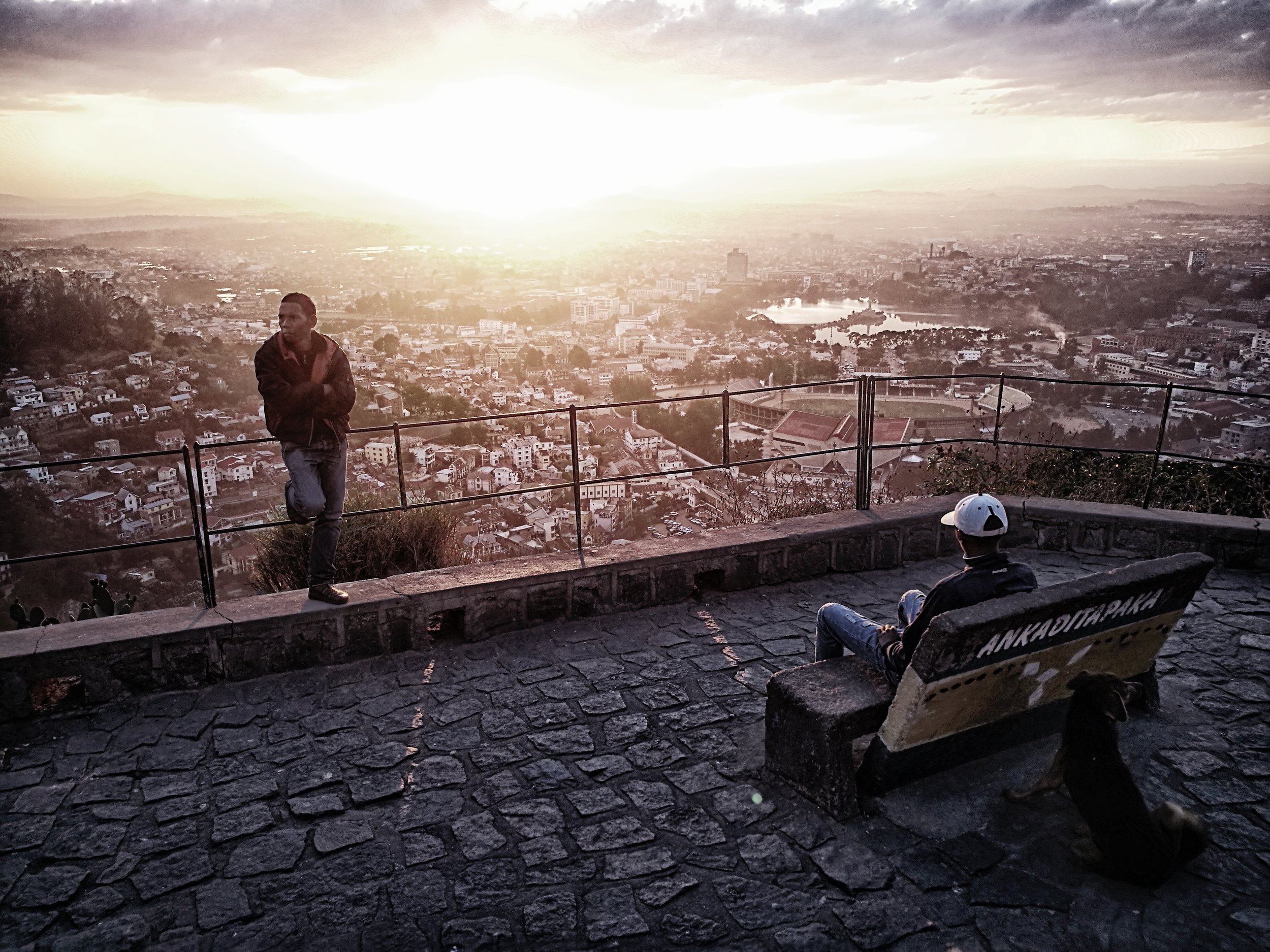 A Man's City Two young men take time to relax on a large terrace overlooking the city of Antananarivo, as yet unaware of what this night has in store for them.