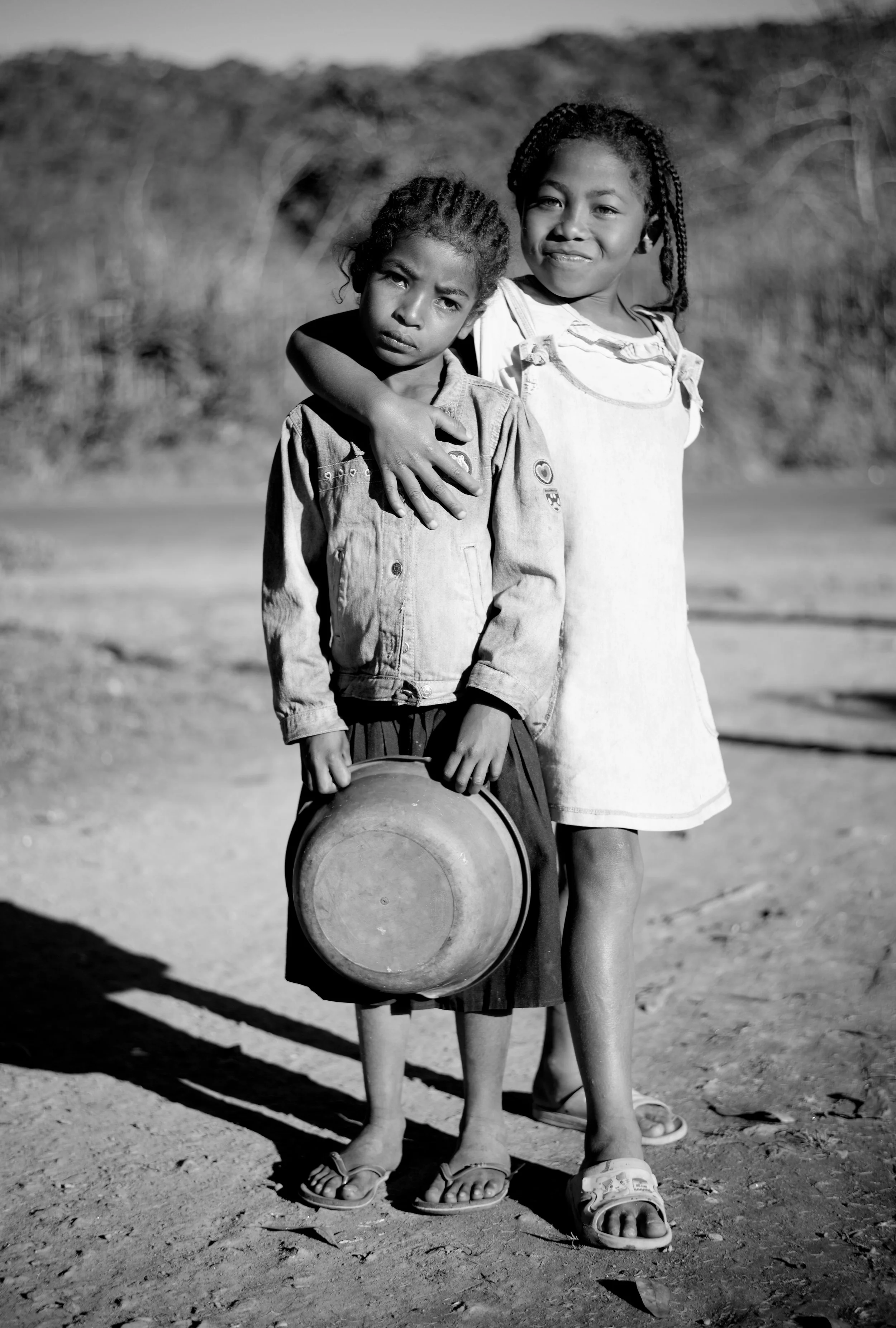 Pepita and Eliza As well as the contrasting light and shadows in this image, I love the contrasting looks that the girls are giving. Eliza, the older friend looks comfortable and self-assured, with one step placed forward. Pepita looks at the