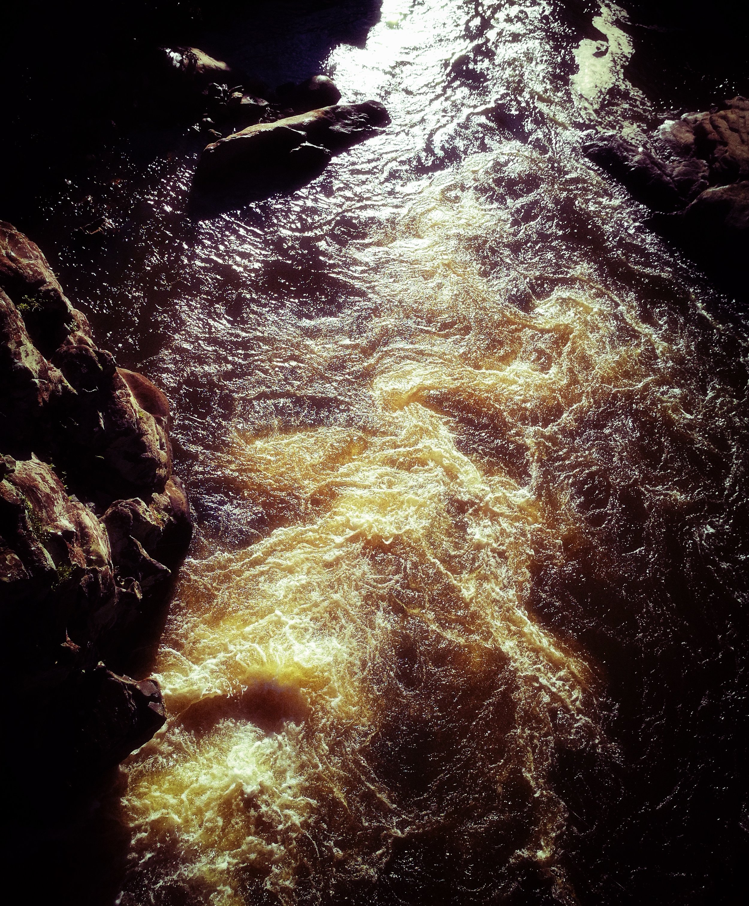 Gushing River Water flows out of natural springs before entering the brackish lakes below.