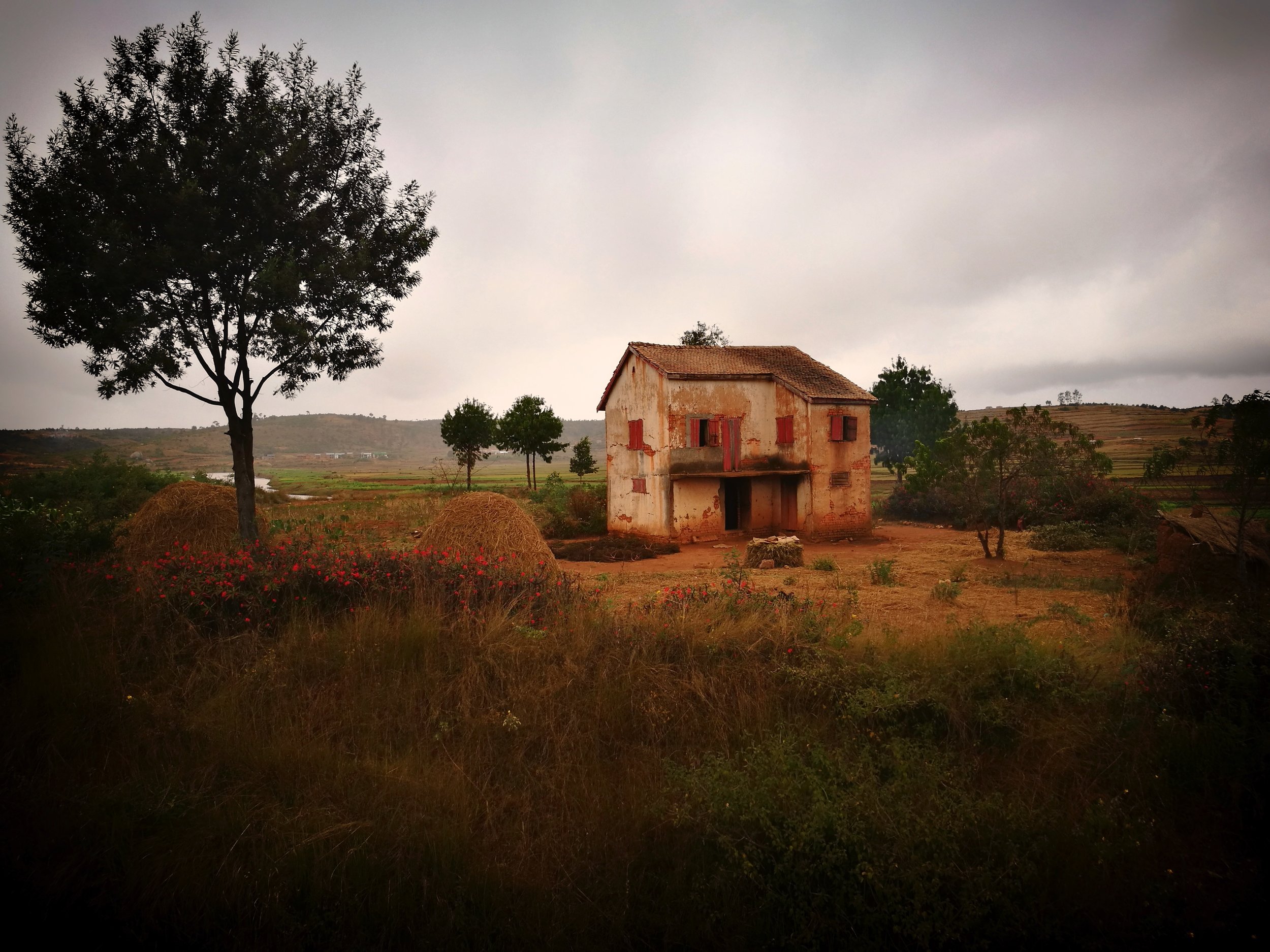 The Farm Rain approaches a lonely farm on the hills.