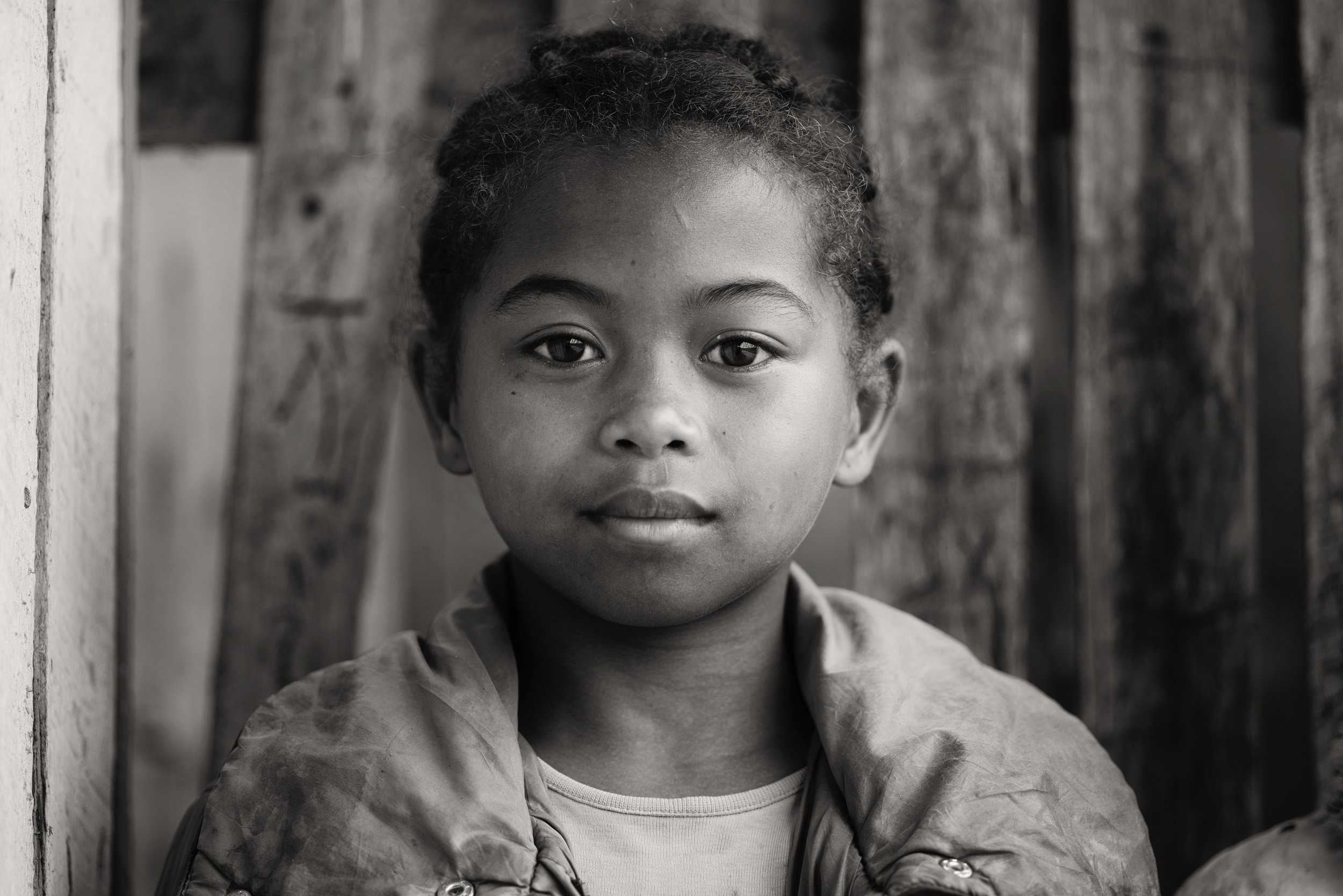 Remi School attendance is incredibly low in Madagascar, even when compared to other countries on the mainland. Remi smiled confidently at the camera as we took her photograph on her way to school.