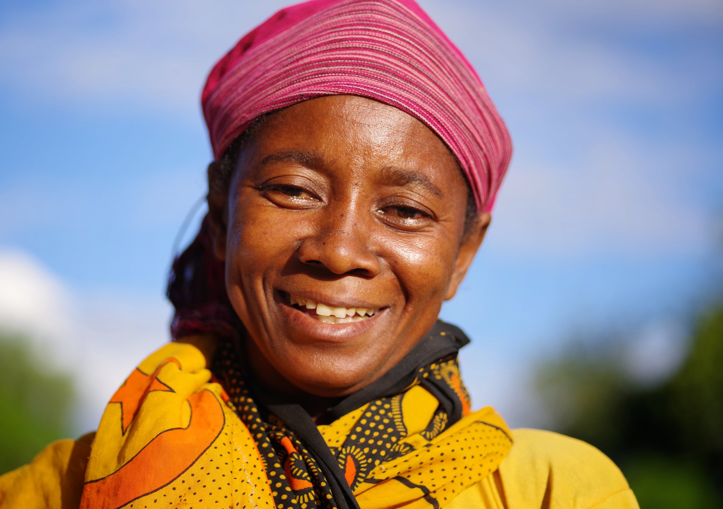 Sonja A Malagasy mother from Ambanja, Sonja watches over her children as they play with fiends in open fields.