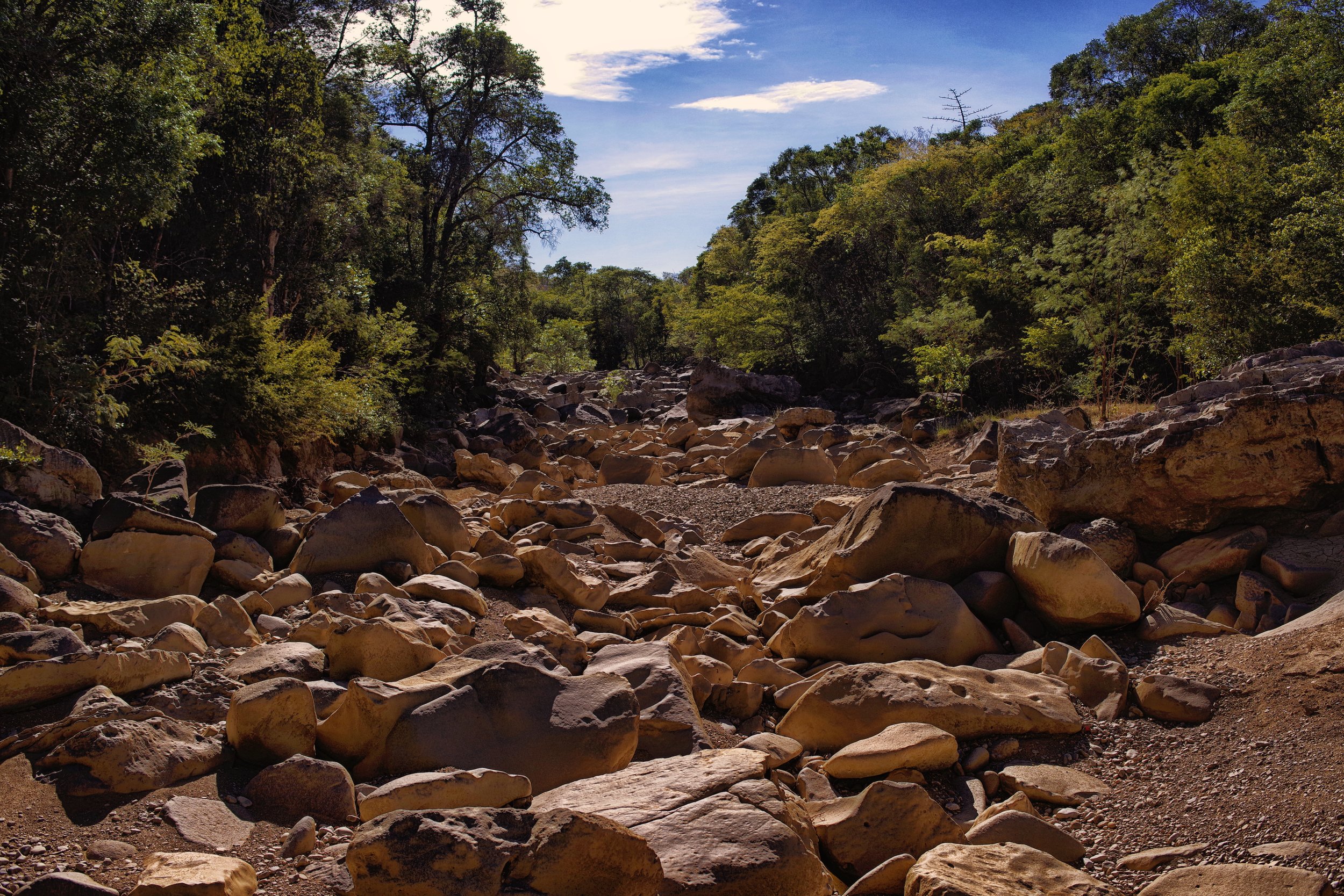 Rocky River Bed In the summer months, when most of the river has dried up, large limestone boulders and rocks litter the valley floor.