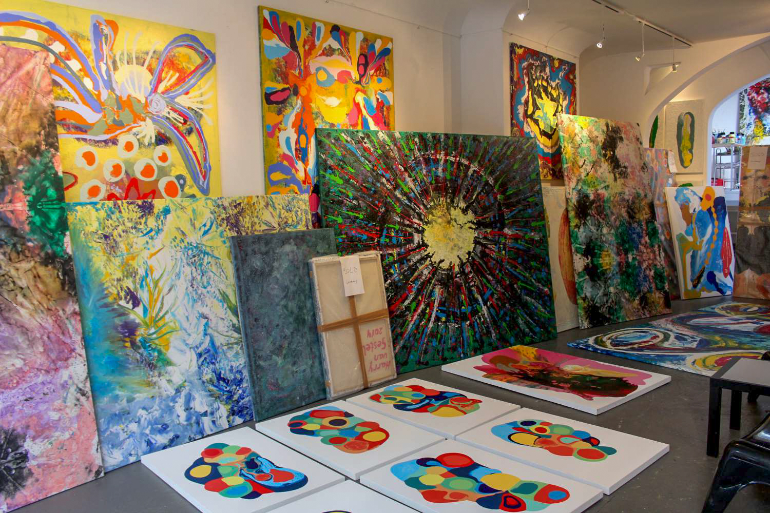 Large colorful paintings in the art studio Harry van Gestel in Amsterdam
