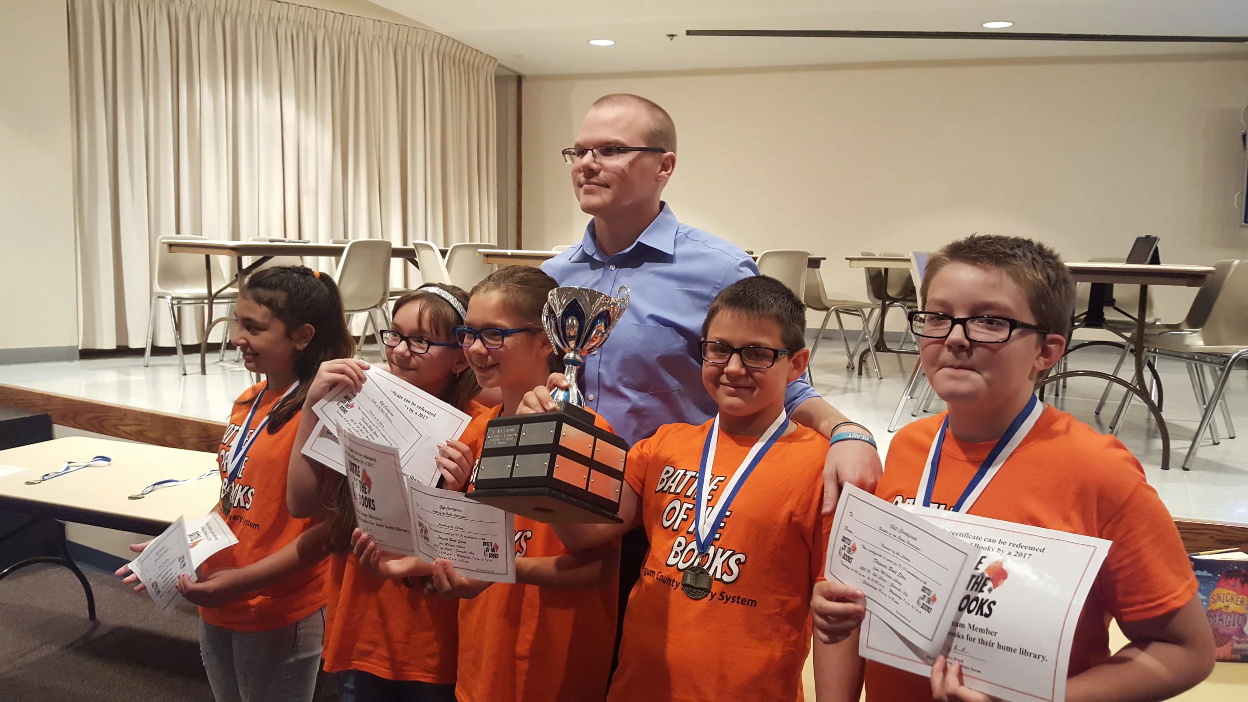 The 2017 champions of the Battle of the Books, posing here with their teacher and the BoB trophy.