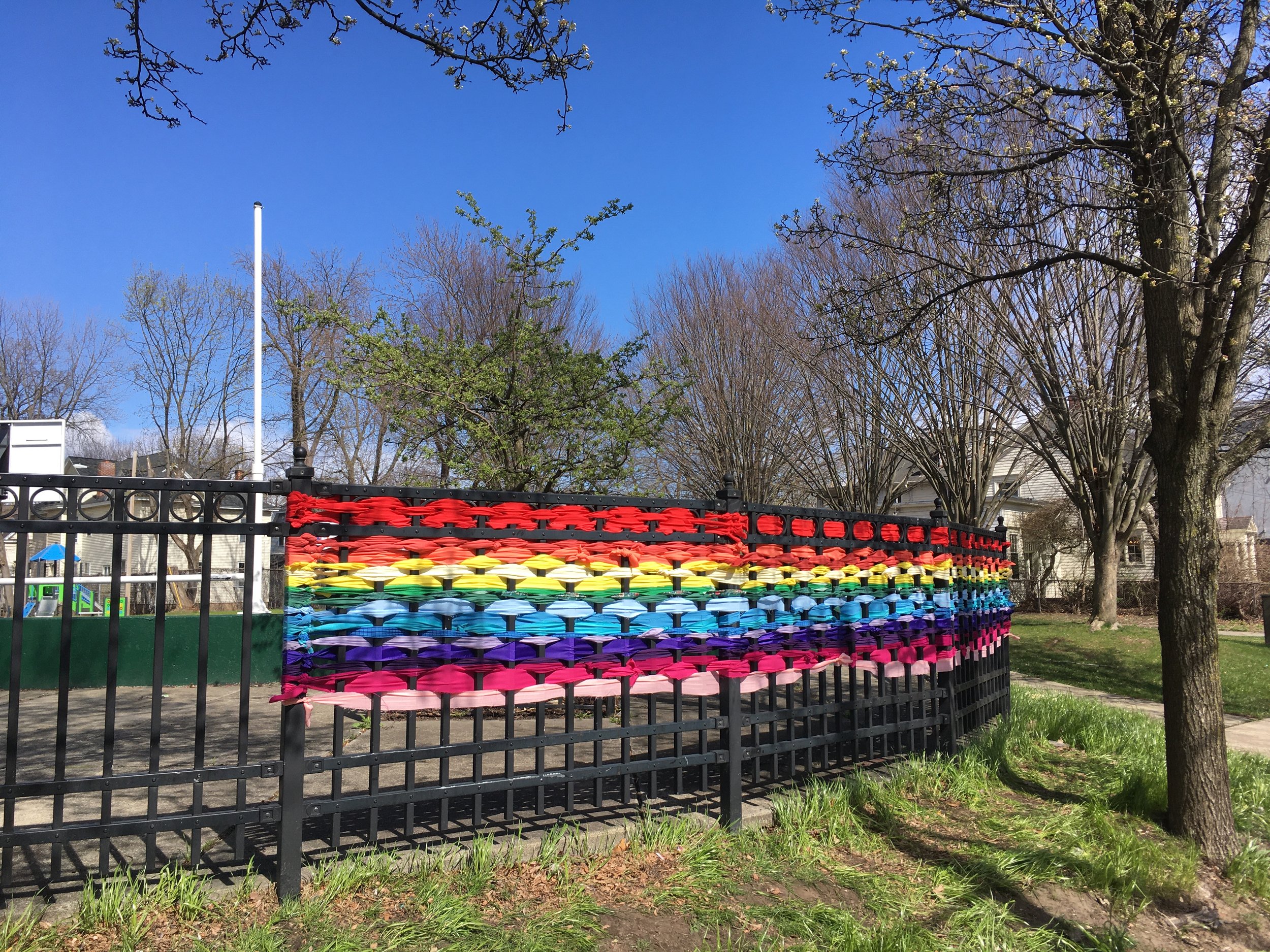  Public weaving project by Megan Stasi and Sandy Schneider using discarded and upcycled fabric.  Done at the beginning of the pandemic in 2020 to give hope to the community at a very uncertain time.  Madison Avenue Playground, April 16, 2020 