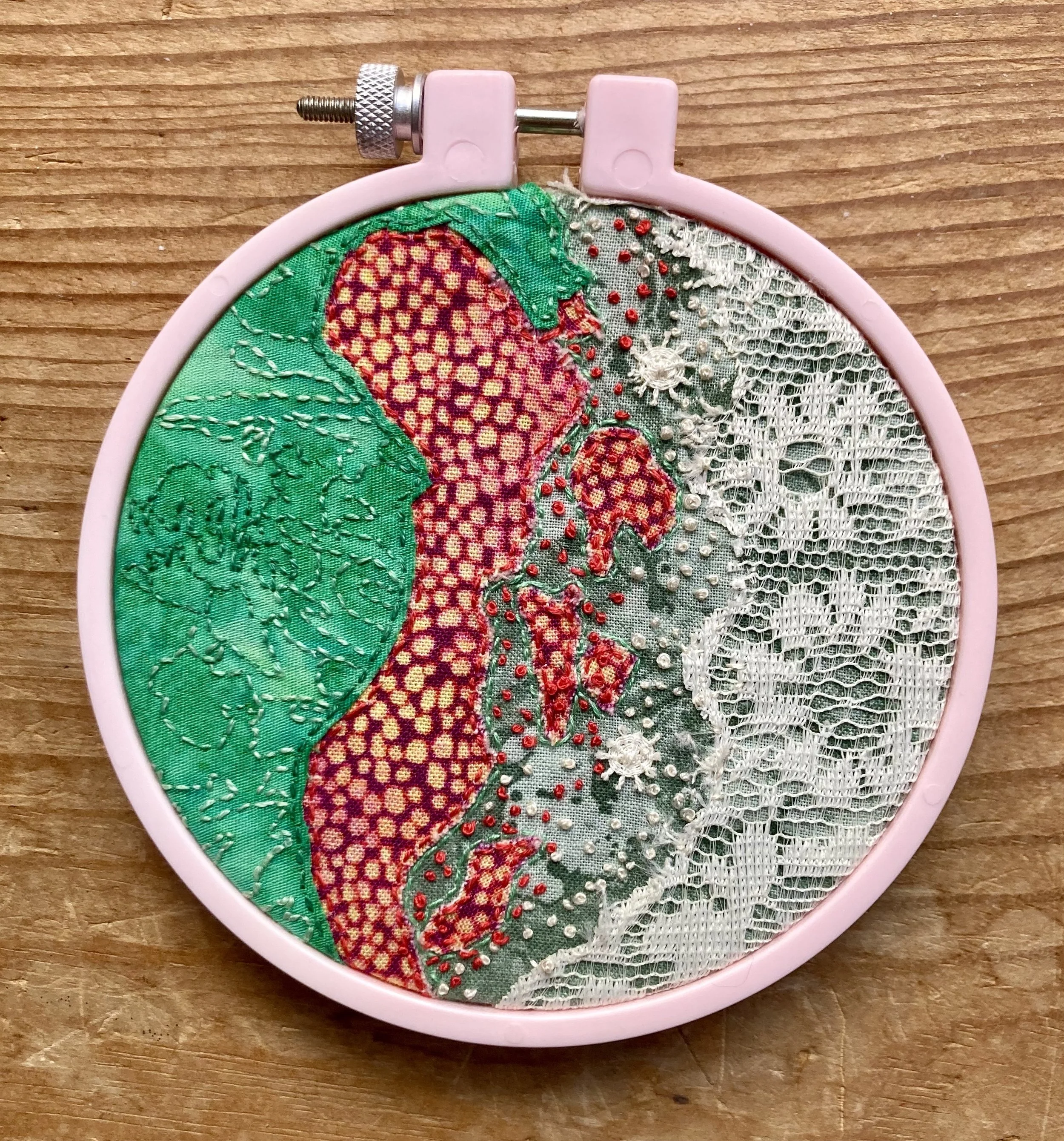 Abington Reef, Sudan up-cycled fabric and thread, second hand hoop 4 1/2” x 4 1/2” hand sewn
