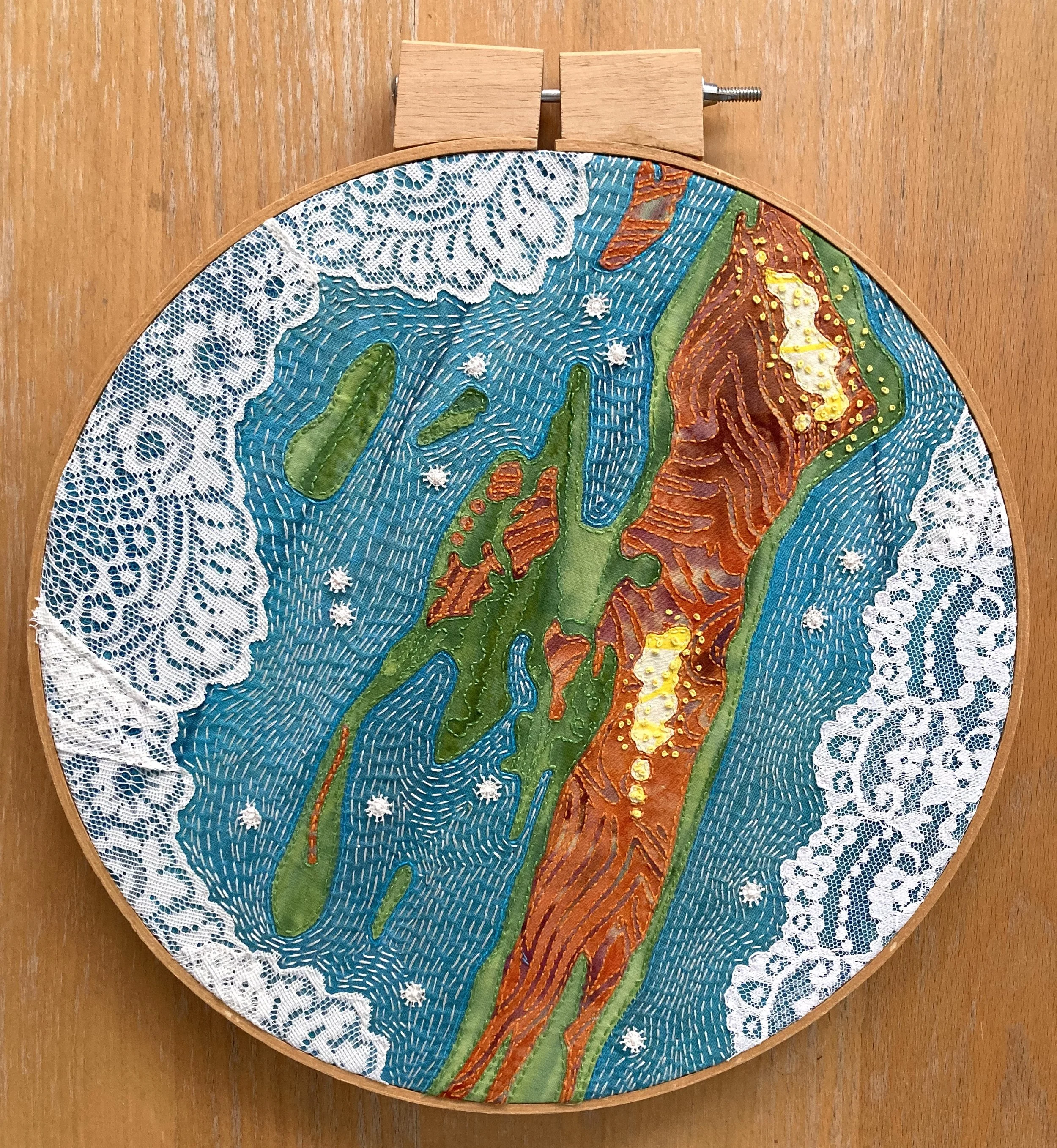   Ambergris Caye, Island in Belize   up-cycled fabric and thread, second hand hoop  12” x 14”  hand sewn 