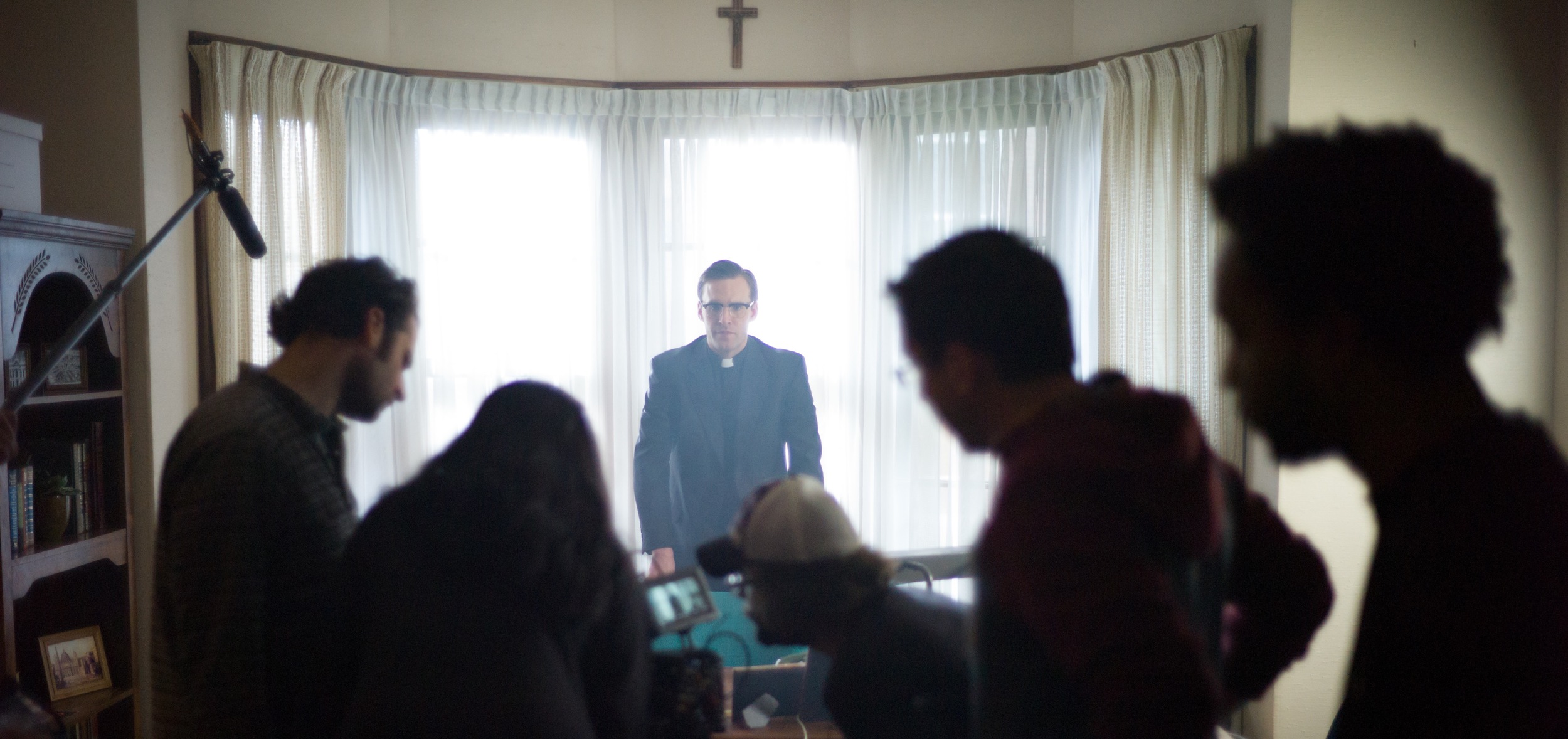 JONATHAN STEWART AS BISHOP THOMAS GUMBLETON AND THE CREW OF AMERICAN PROPHET.