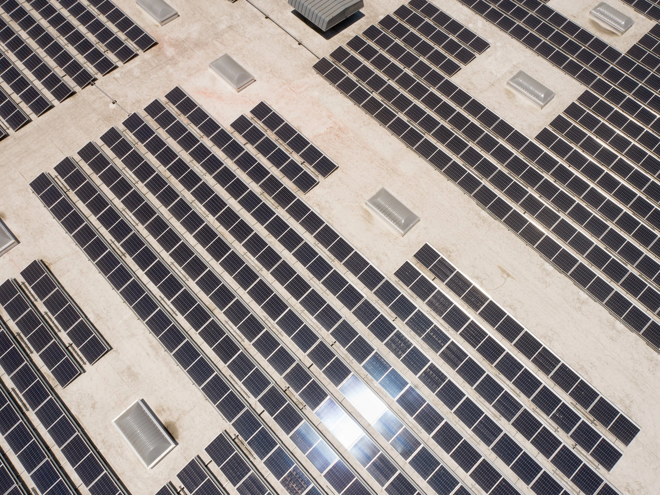 Drone aerial photograph of a commercial rooftop solar installation