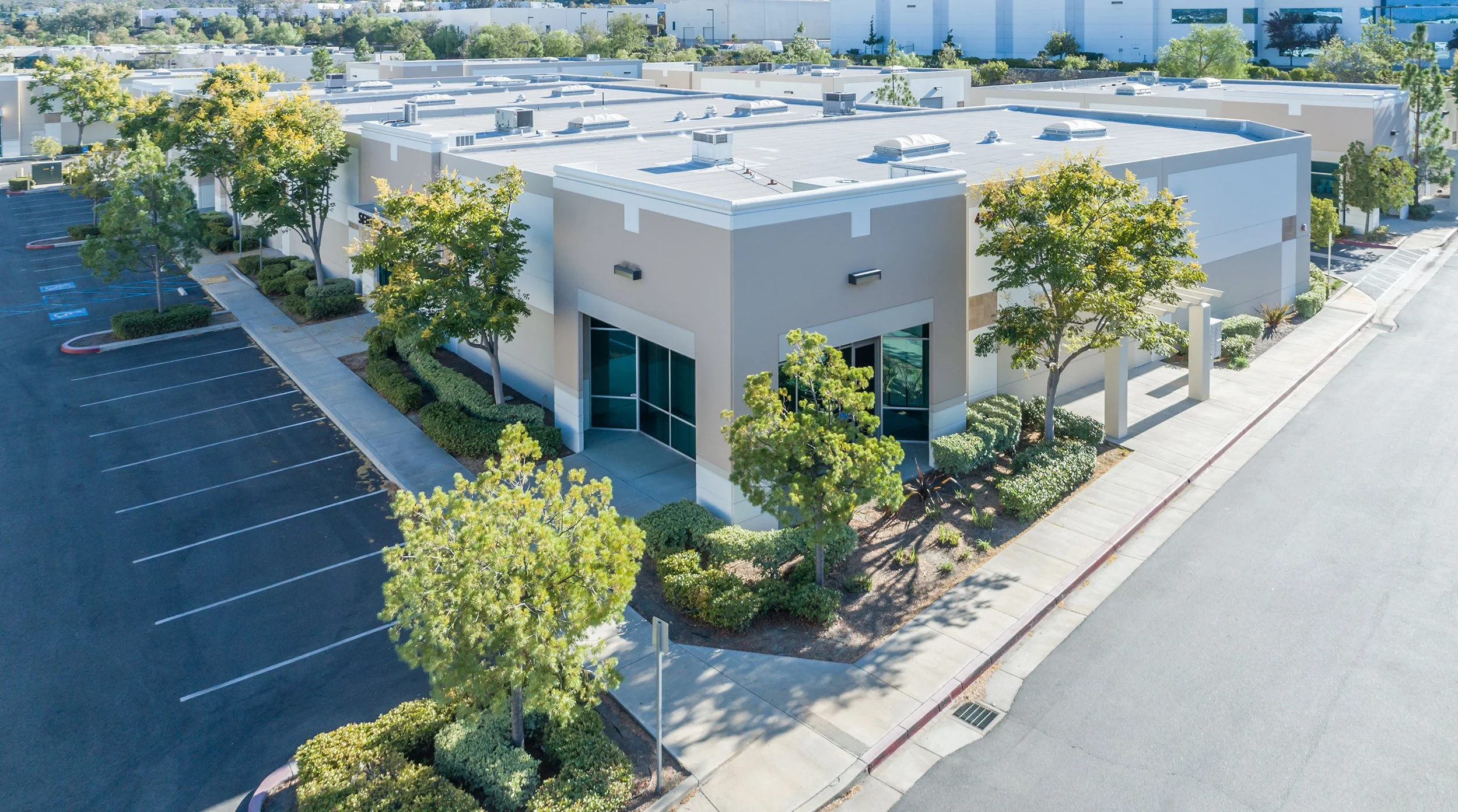 Aerial drone photograph of a commercial office and industrial property in Southern California