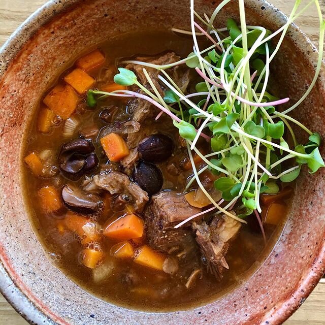 Nourishing meal for the boys and I on single digit wintery days. Slow cooked beef ribs in foraged mushroom broth. Plenty of @ironwoodorganic carrots, hot leached acorns, and @bahnerfarmmaine spicy micro greens. Finished with a two year kidney bean miso.