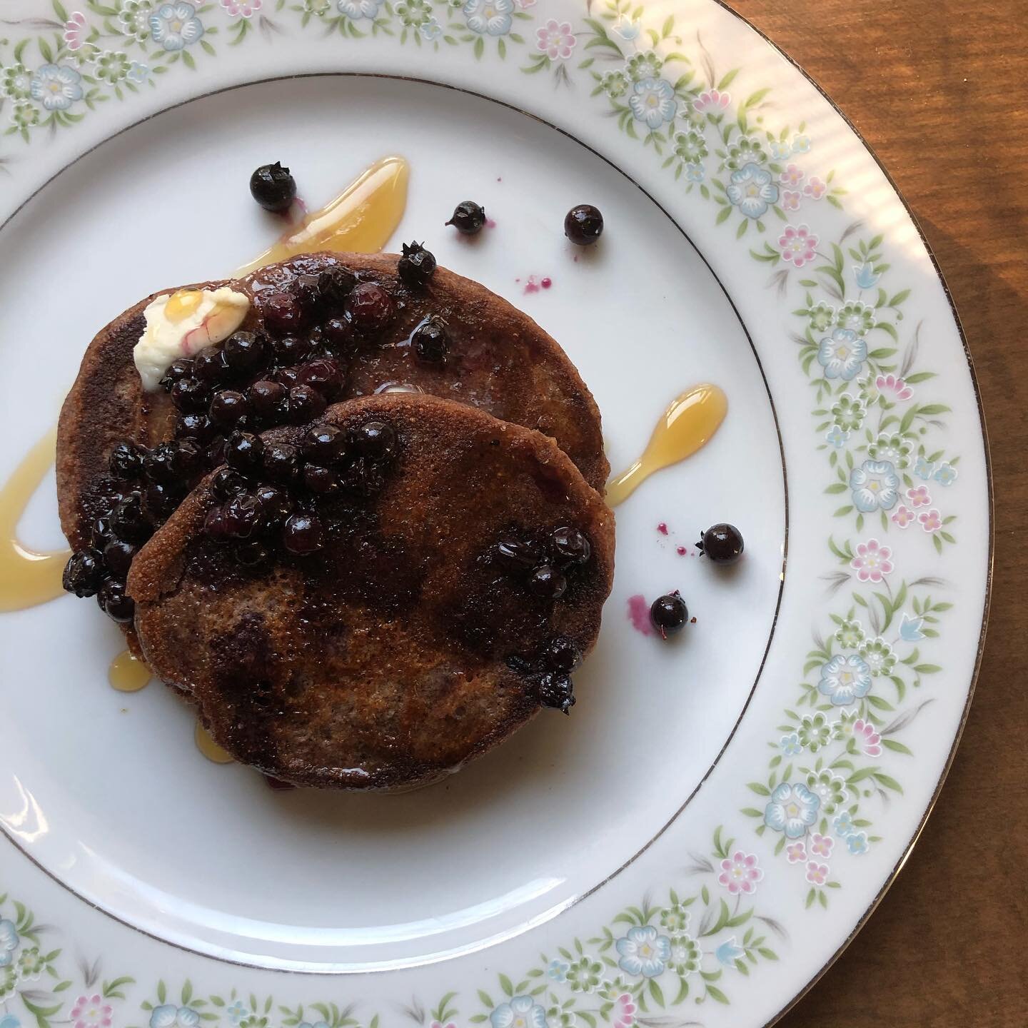 Cooking up our favorite maple syrup delivery system... pancakes made from @mistybrookfarmme rye flour and cold leached acorn flour. Topped with wild blueberries, butter and our freshly made syrup.