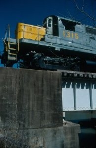  The event got started Friday afternoon as the train was put together and the tracks were cleared for the event. Here, 1315 is on the Poplar Creek bridge on the K-Line, moving a string of intermodal flats. 