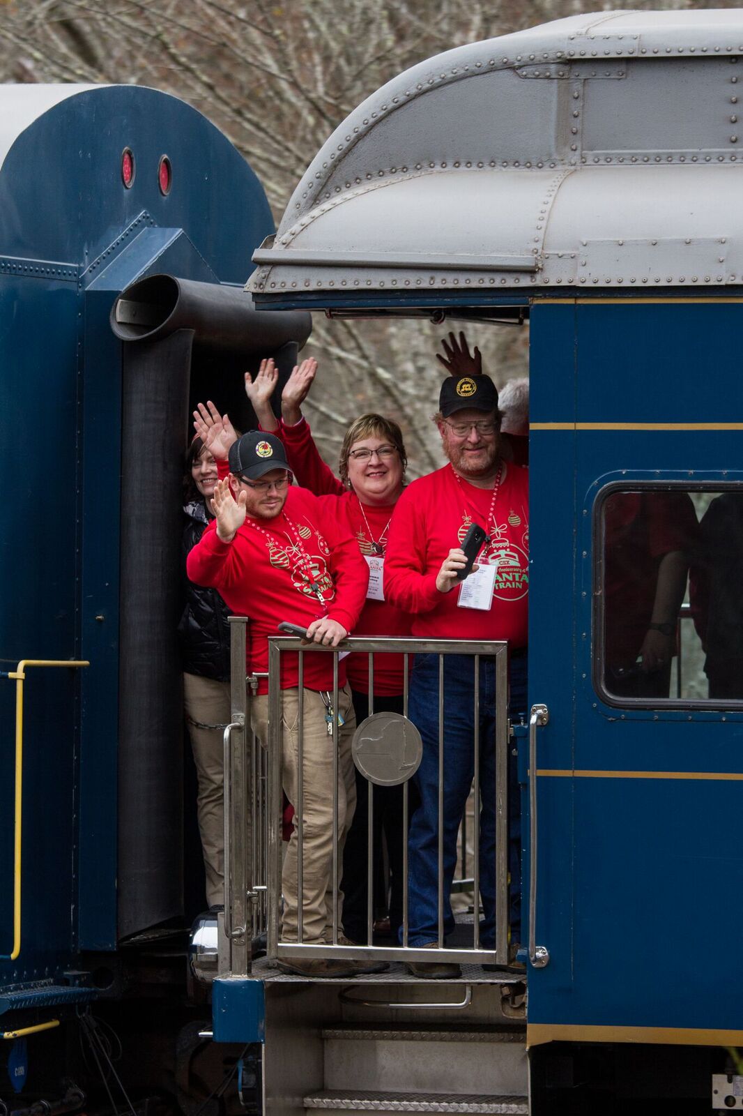 Museum Director Charlie Poling and his wife, plus museum volunteer Wade White ride the Santa Train. Peyton Gupton photo.