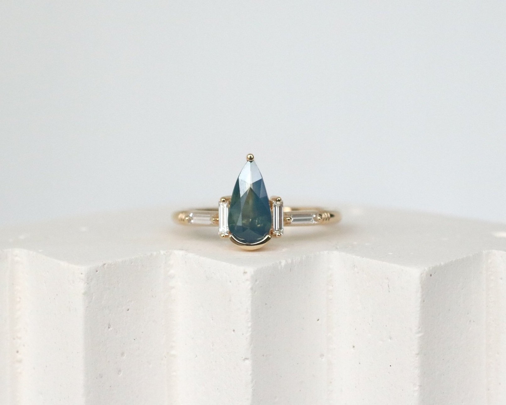 NIA ENGAGEMENT RING - BLUE PEAR SAPPHIRE + LAB DIAMOND BAGUETTES + 14K YELLOW GOLD