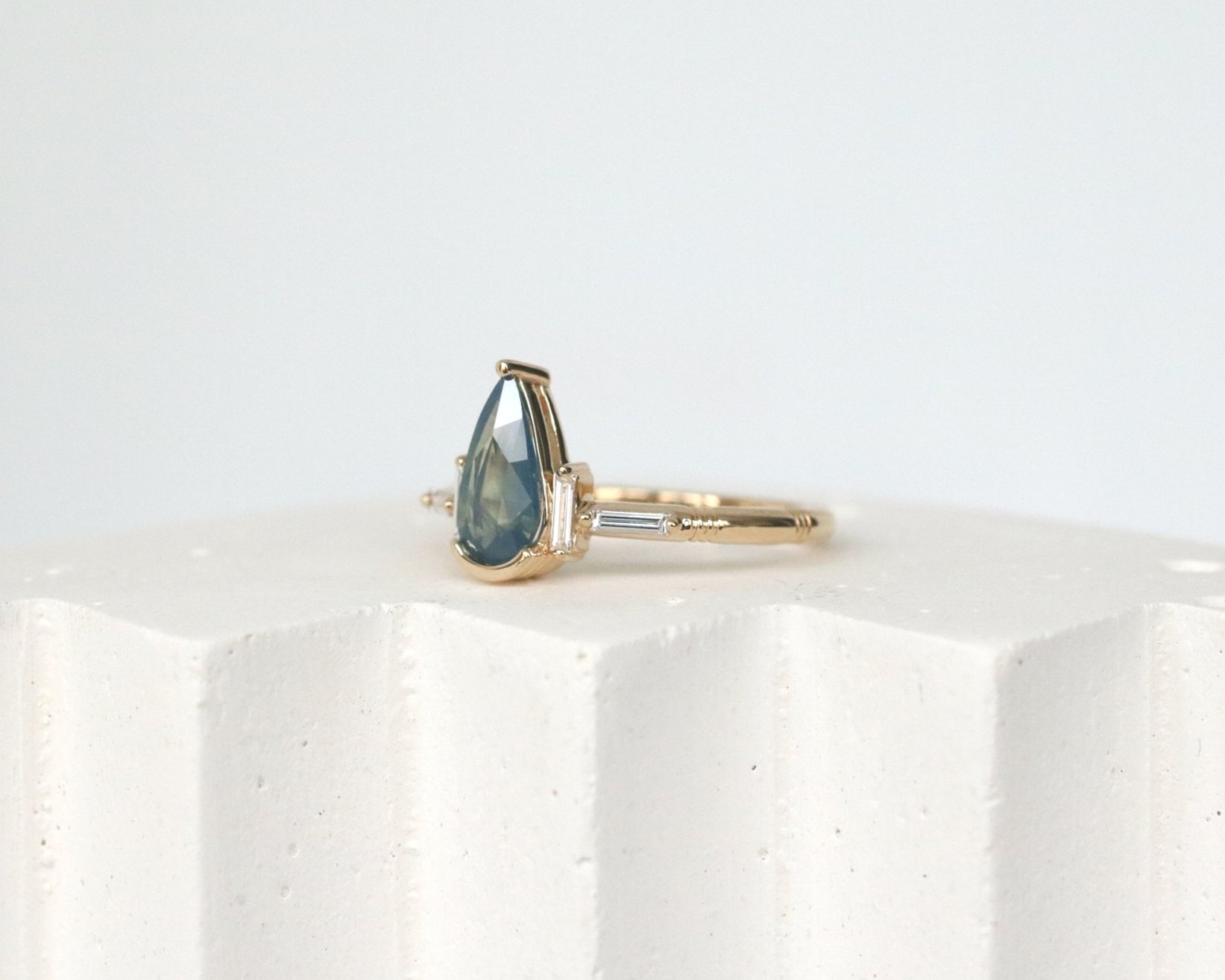 NIA ENGAGEMENT RING - BLUE PEAR SAPPHIRE + LAB DIAMOND BAGUETTES + 14K YELLOW GOLD