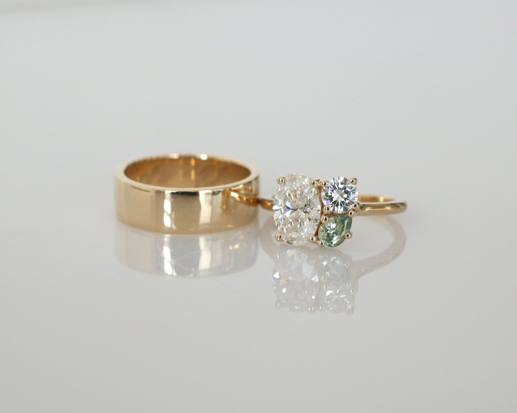 Glennie wedding set- 1.2ct natural oval diamond + heirloom diamond + green Montana sapphire pear + 14k yellow gold