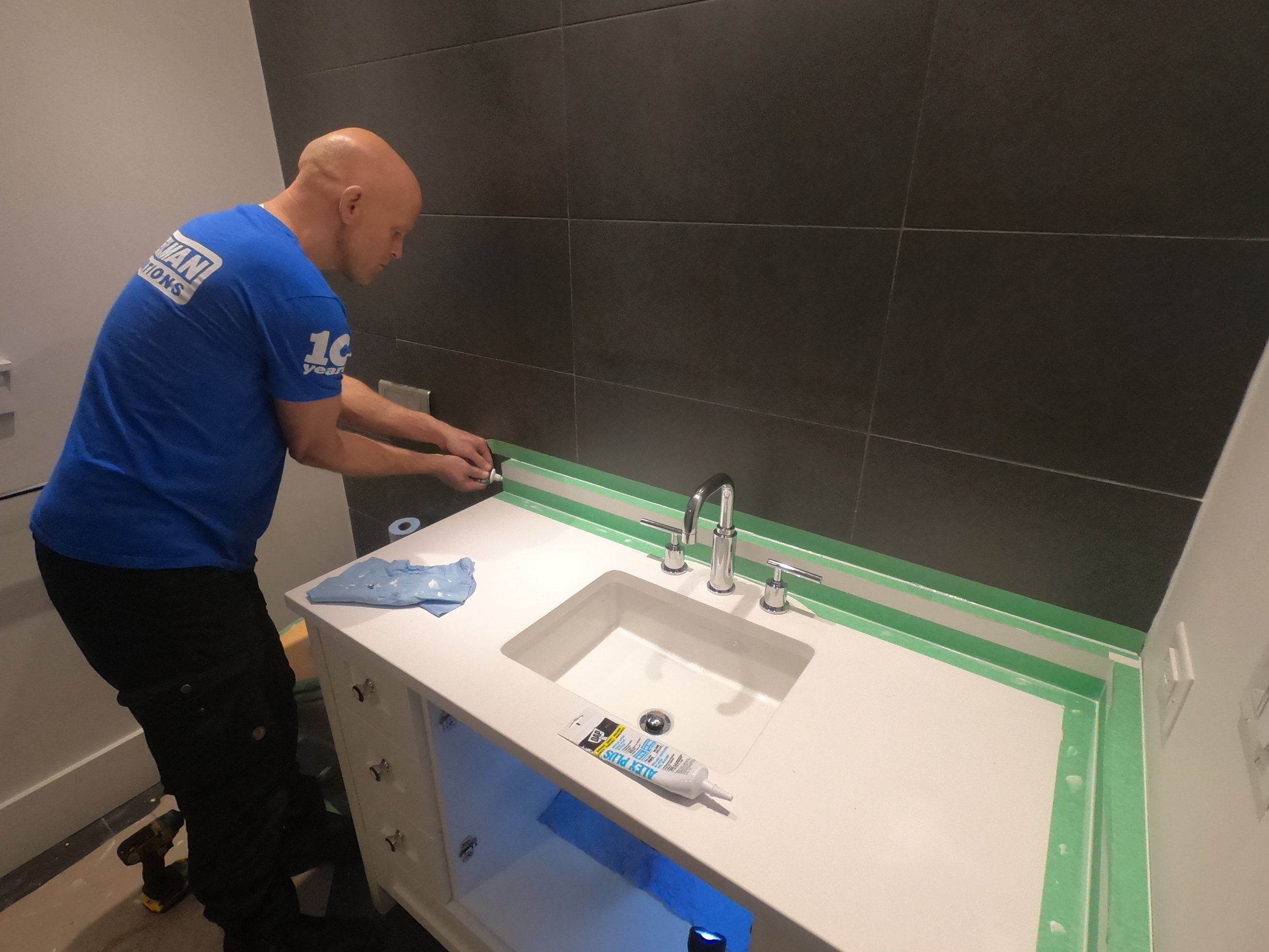 Caulking bathroom countertop for waterproofing