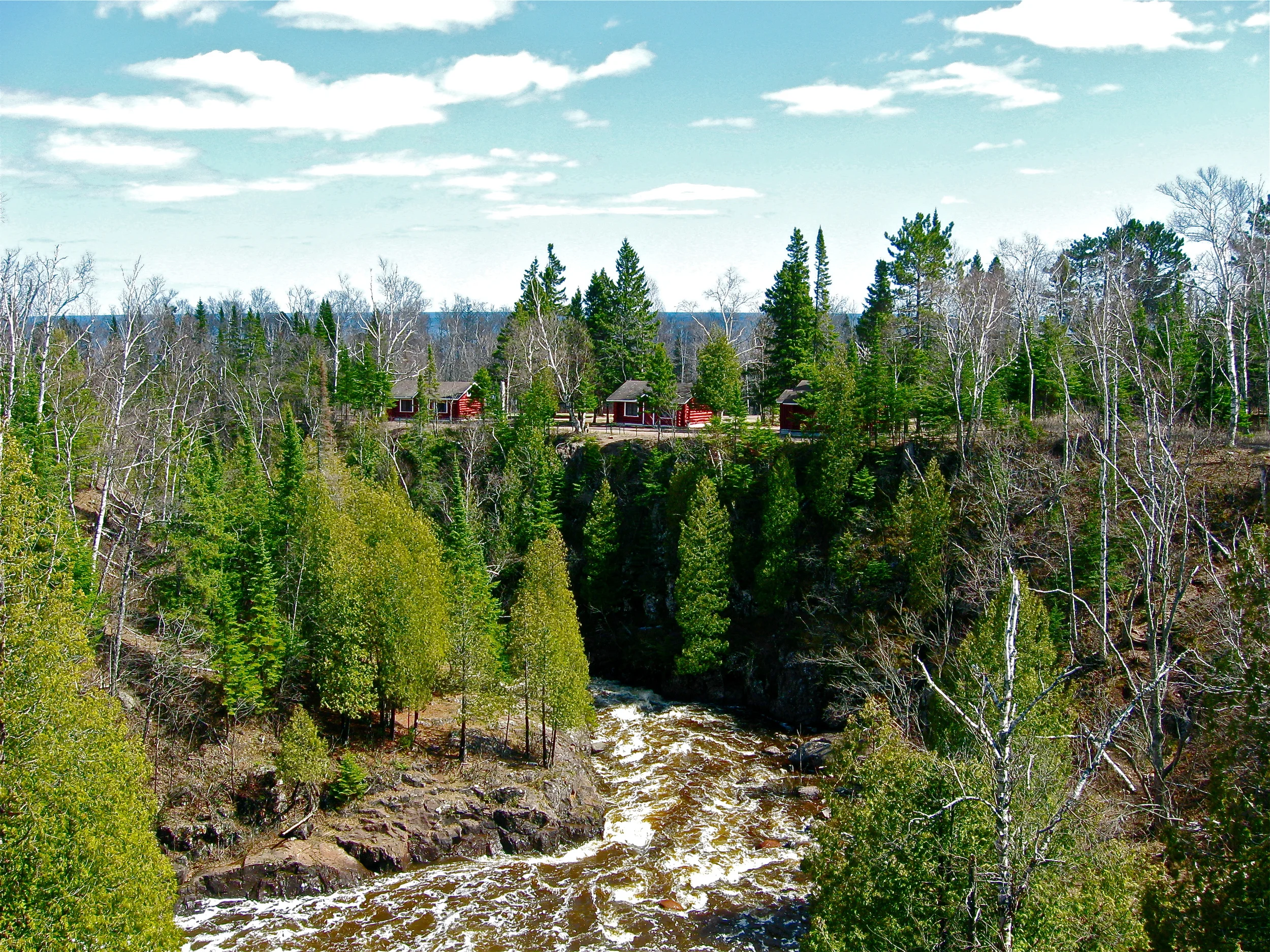 Spring run-off in the Cross River. Those are cabins 1, 2, and 3.