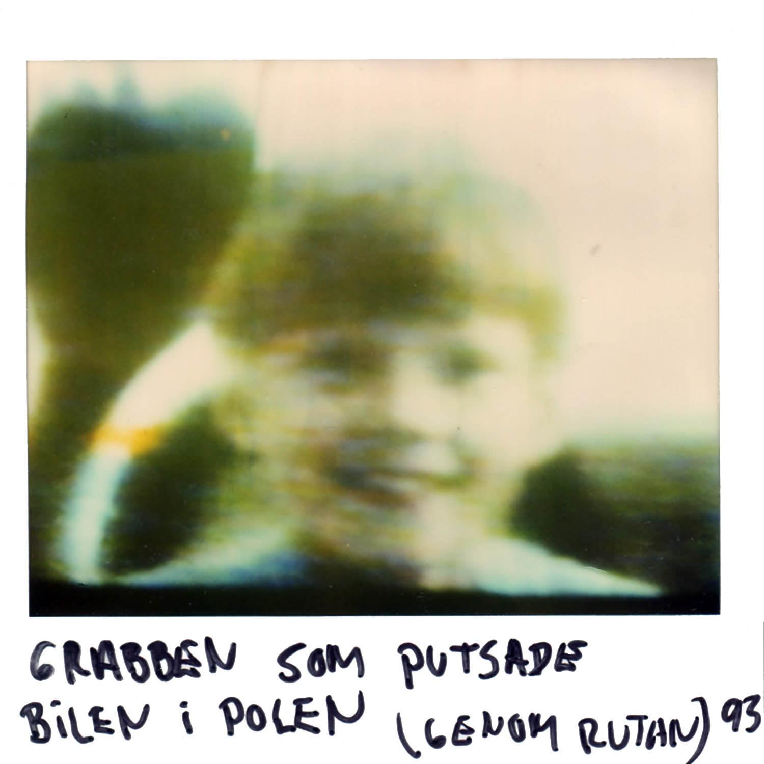 The kid whom cleaned our car in Poland (through the car window) -93