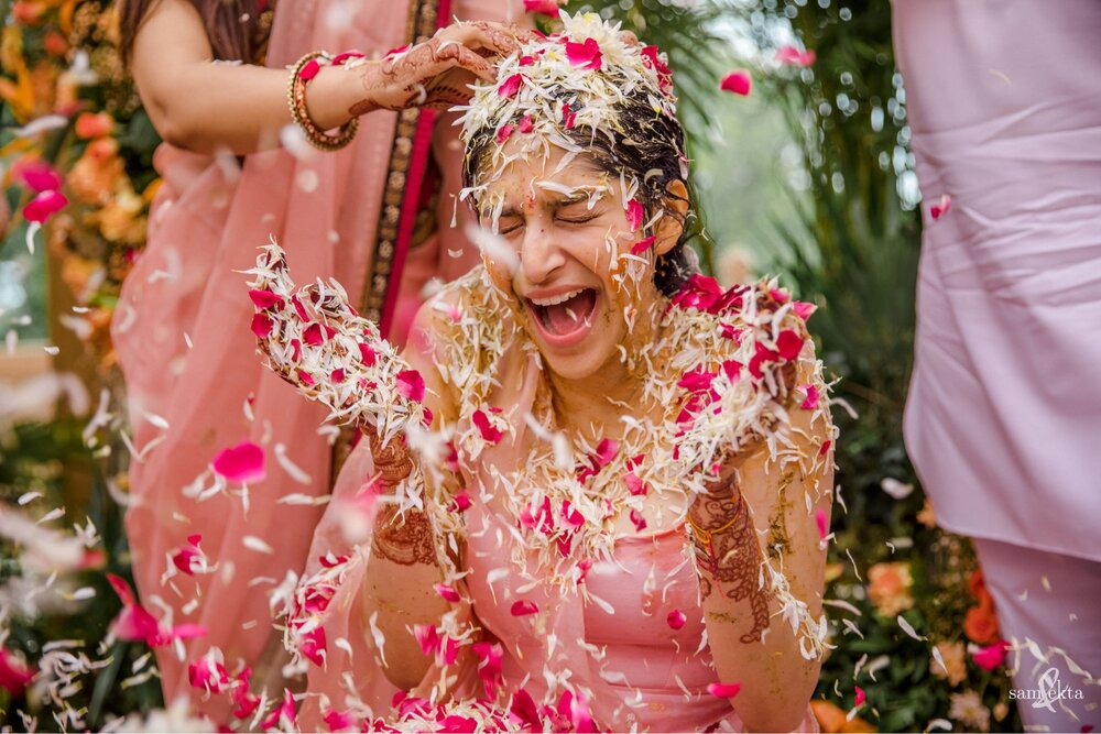 The flower shower that came after the haldi was never ending, and painted everything (and everyone) in white and pink!