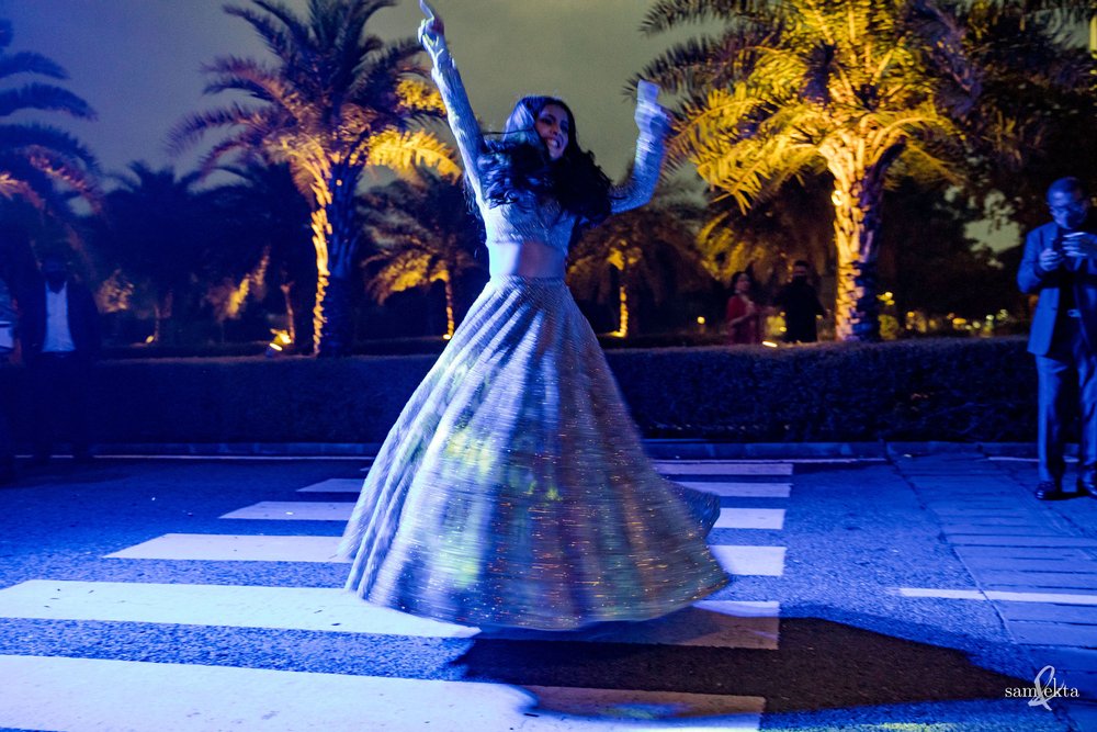 It's rare to see a bride at the baraat, and even rarer to see one floating in the air!