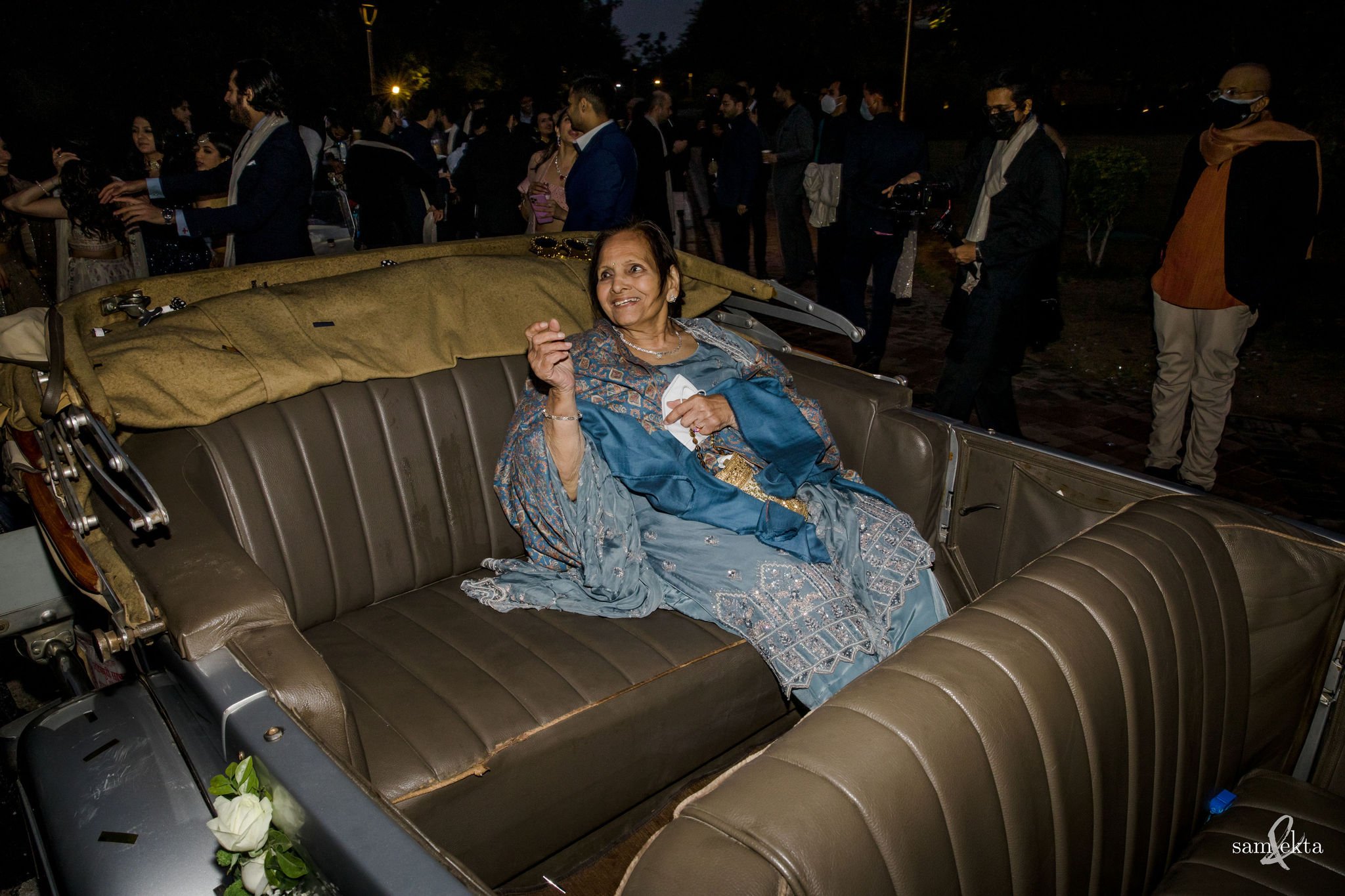 Ishaan's grandmom cheers everyone on from her seat in that beautiful vintage car