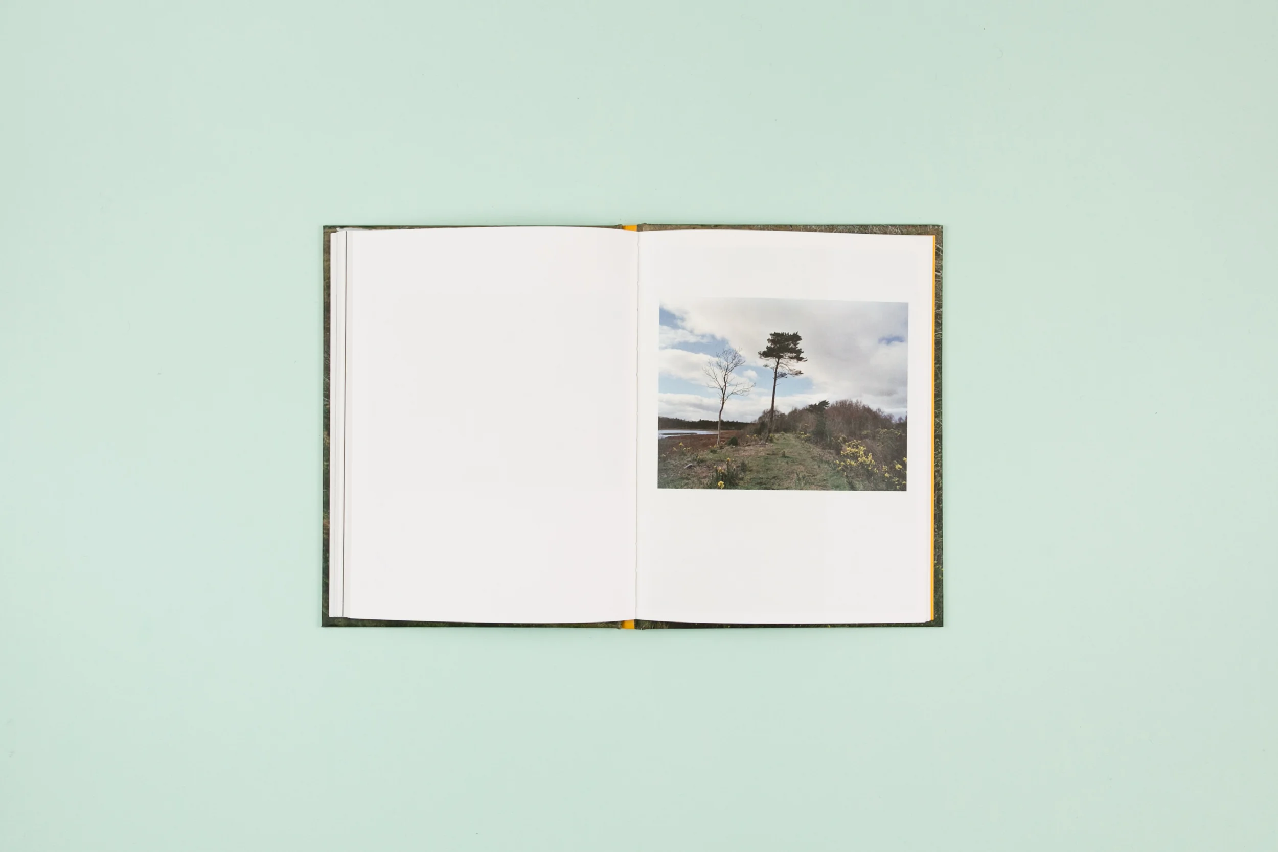 Book spread from The Whistle Blowing a photobook with photography by Lorraine Tuck and Design by Read That Image Collective
