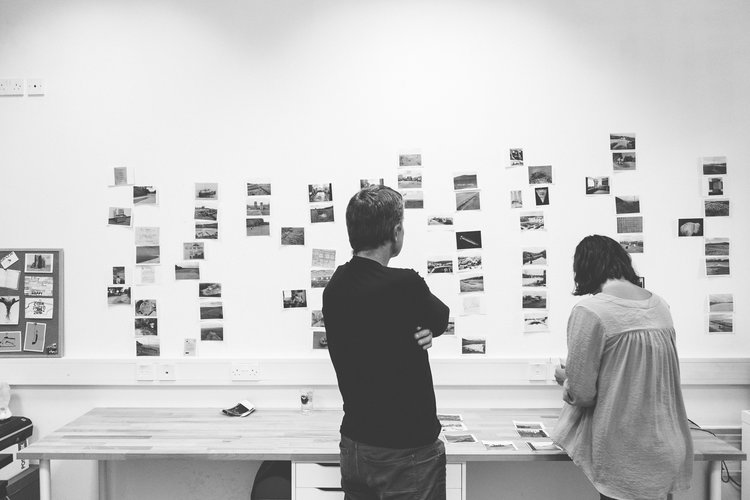 Read That Image designer Kasia Kaminska and photographer Dara McGrath working on image selection and sequencing for his photobook 'Project Cleansweep'.