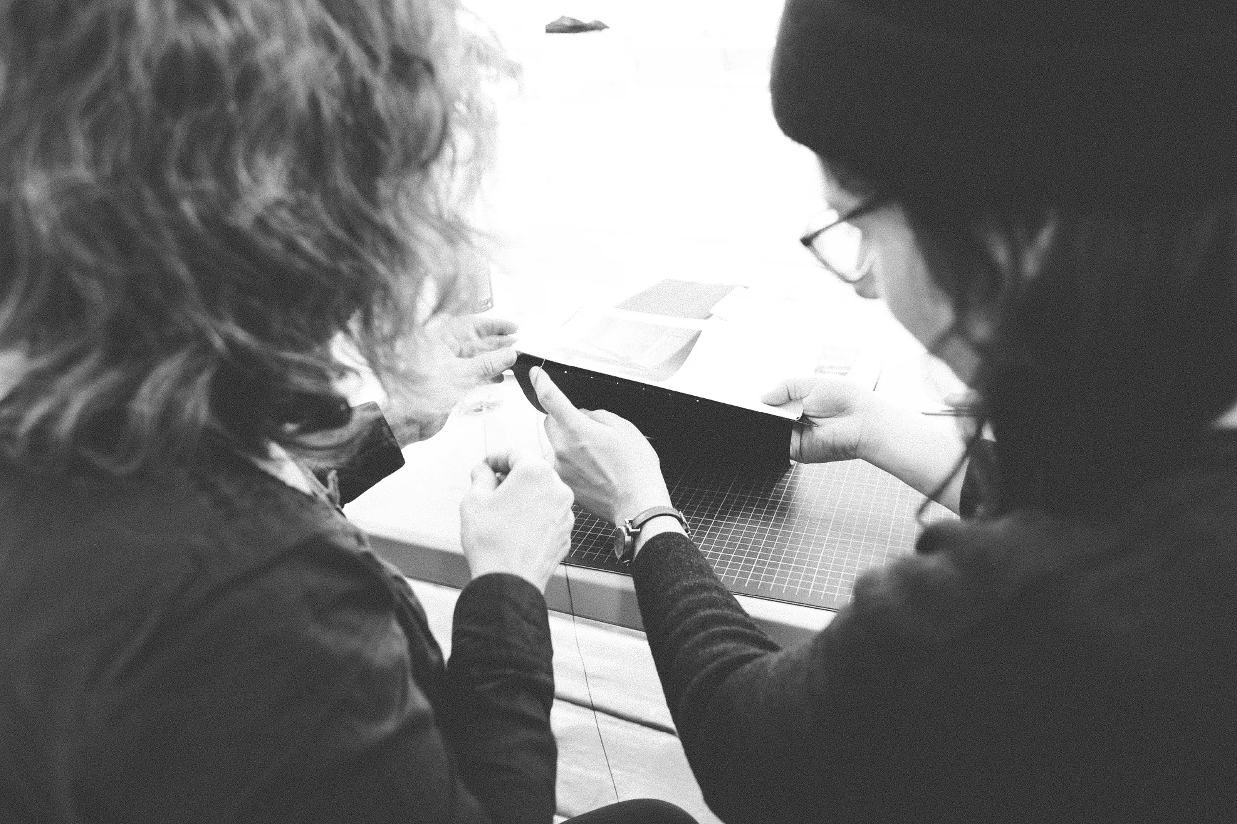 Read That Image member Kasia Kaminska and photographer Esther Moliné binding her photobook dummy 'Five Streets'