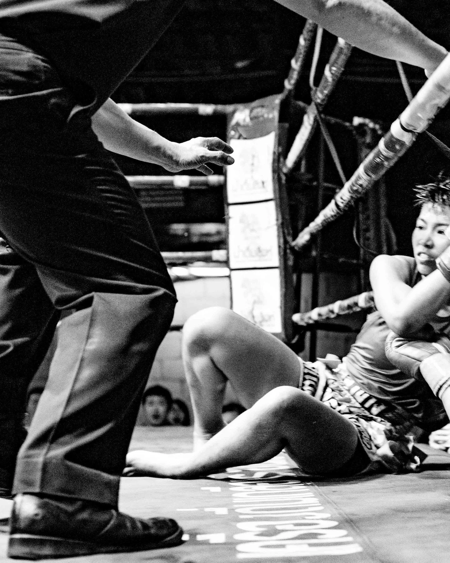 A fighter is bundled out of the ring during her fight in the Taphae Boxing Stadium. #muaythai
