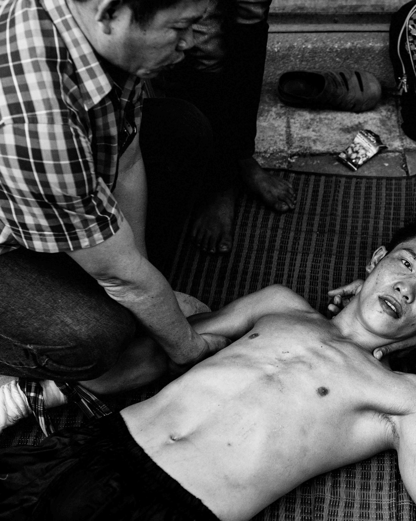 Jaobig Thaikla regains consciousness after a KO during a Muay Kard Chuek bout, fought with rope-bound hands, in gritty Mae Sot &mdash; one of many in a conveyor belt of KOs. #muaykardchuek #maesot #muaythai