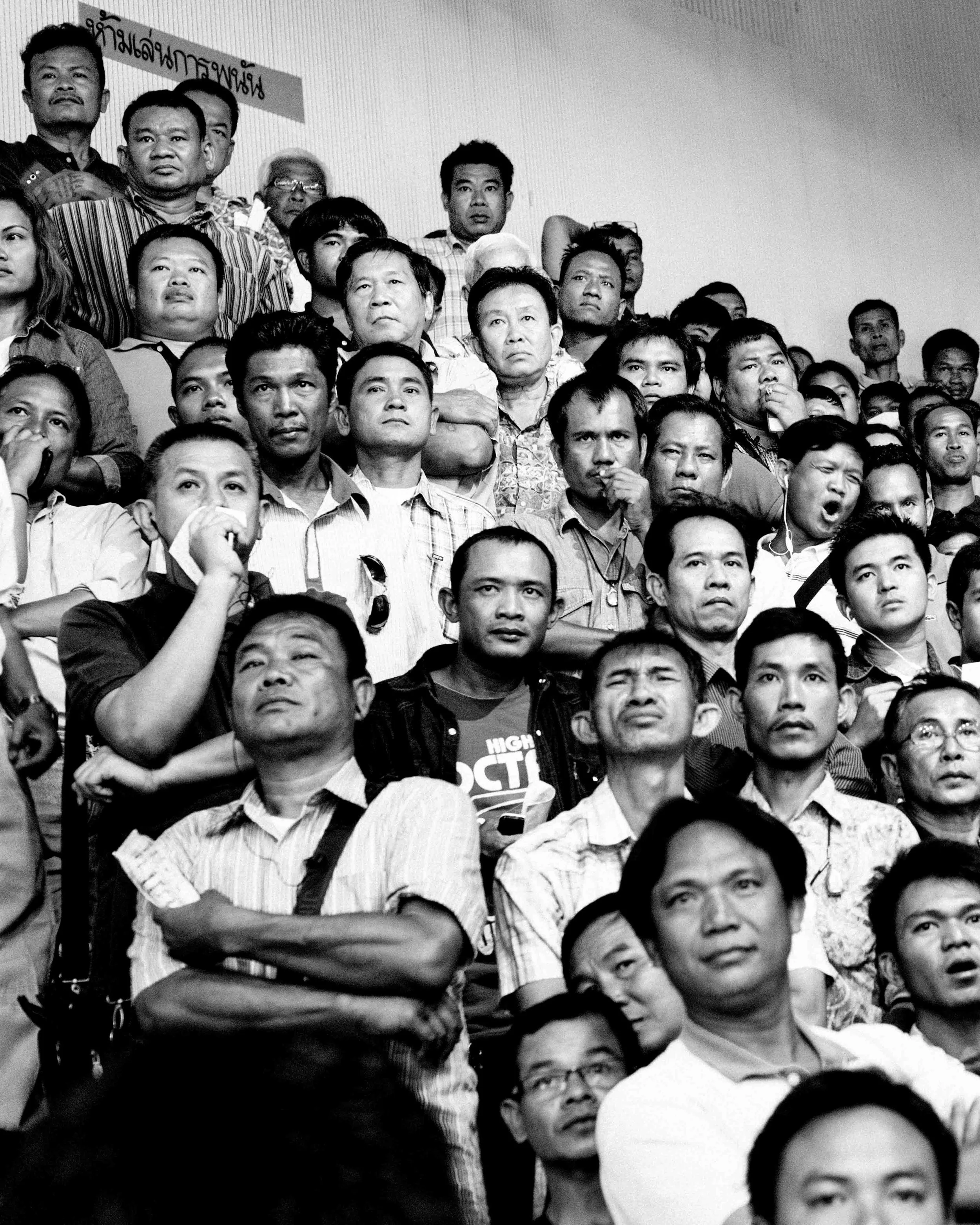 Gamblers look on at their bets in the Channel 7 stadium. #muaythai