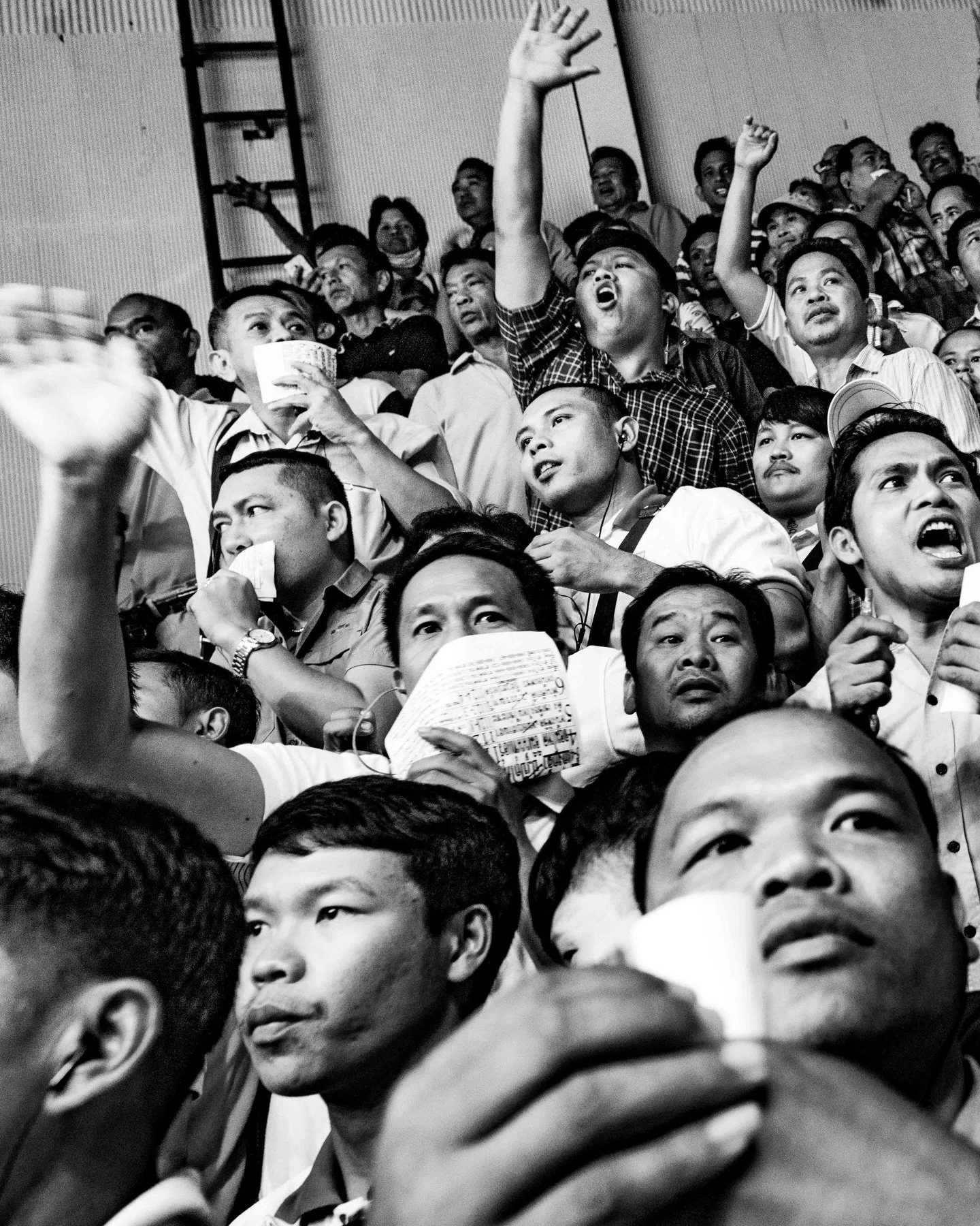 Gamblers at the Channel 7 stadium cheer on their fighters in an attempt to influence the scorecard. #muaythai