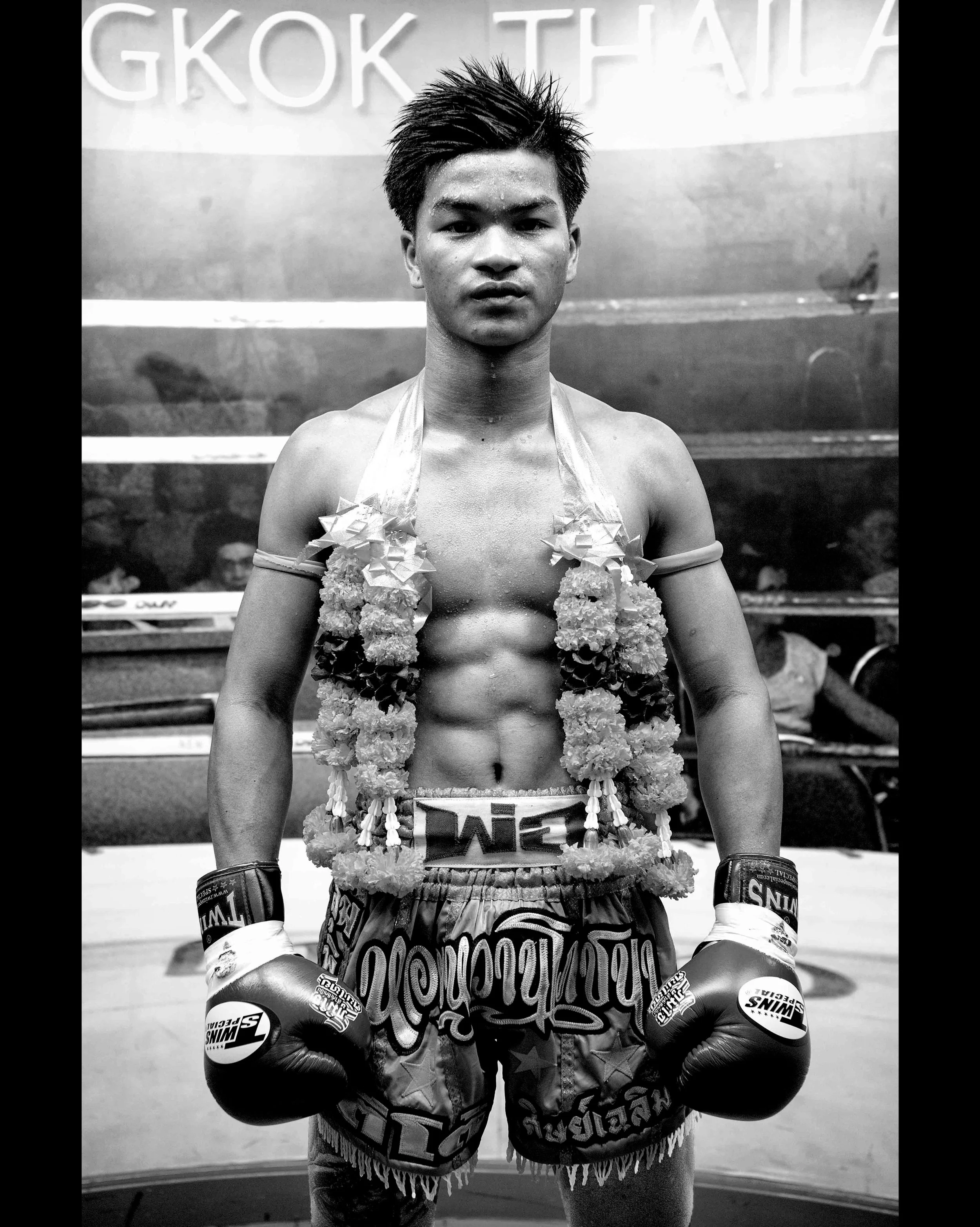 A fighter poses in the Lumpinee stadium after his KO victory. #muaythai