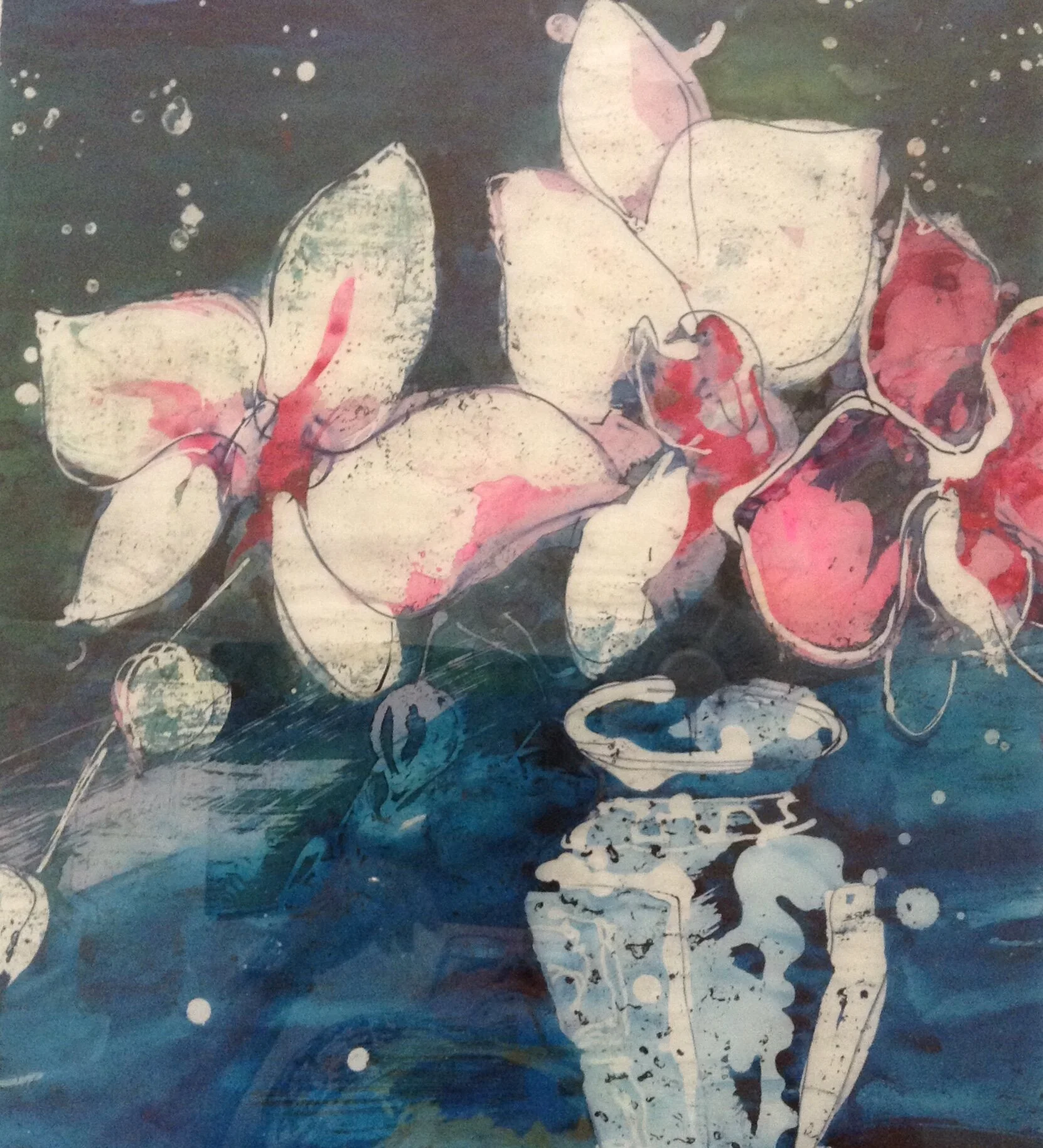 Orchids in blue vase