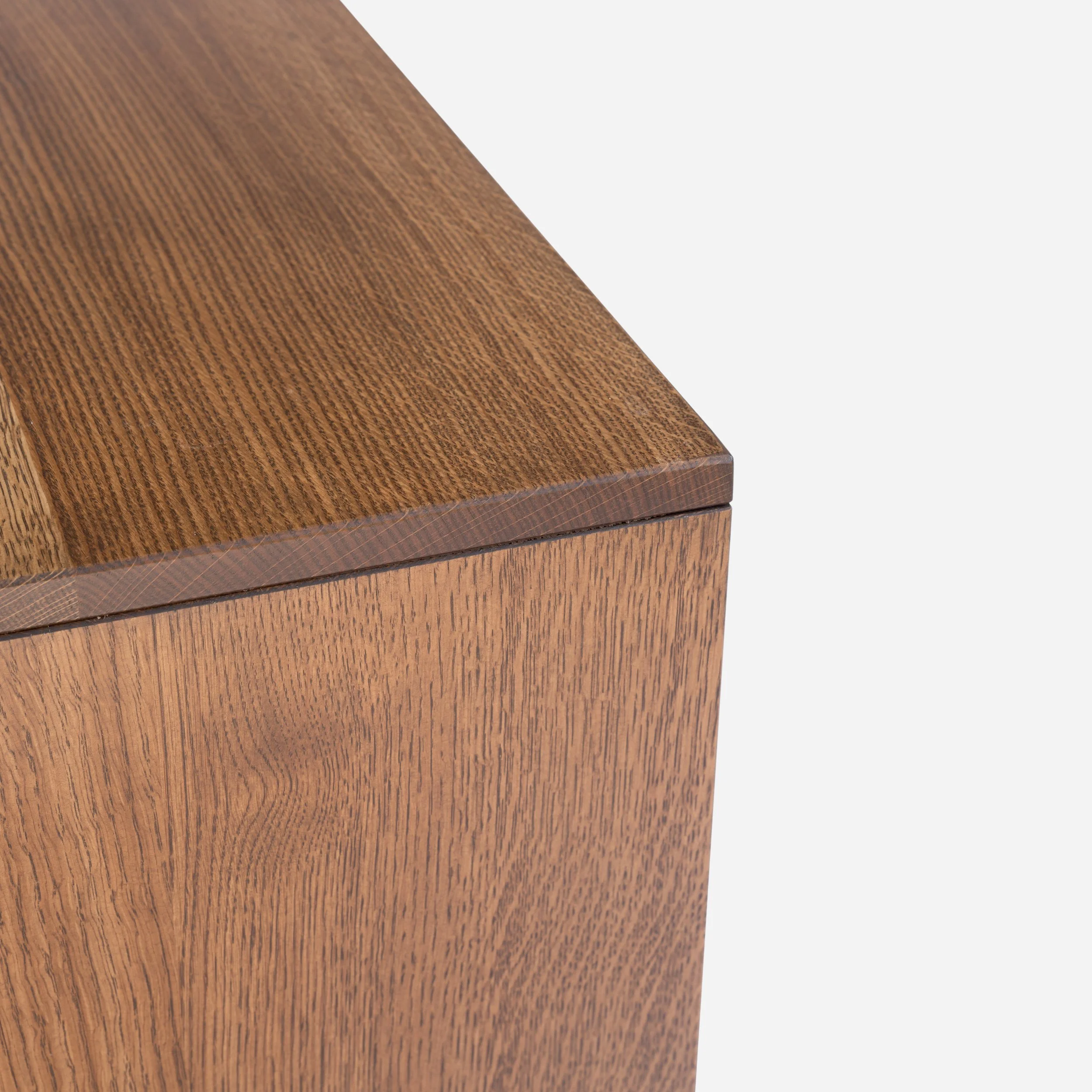 Handcrafted Strata Coffee Table made from solid white oak with light brown stain and bold black base, showcasing natural wood grain with architectural design, made in Milwaukee.