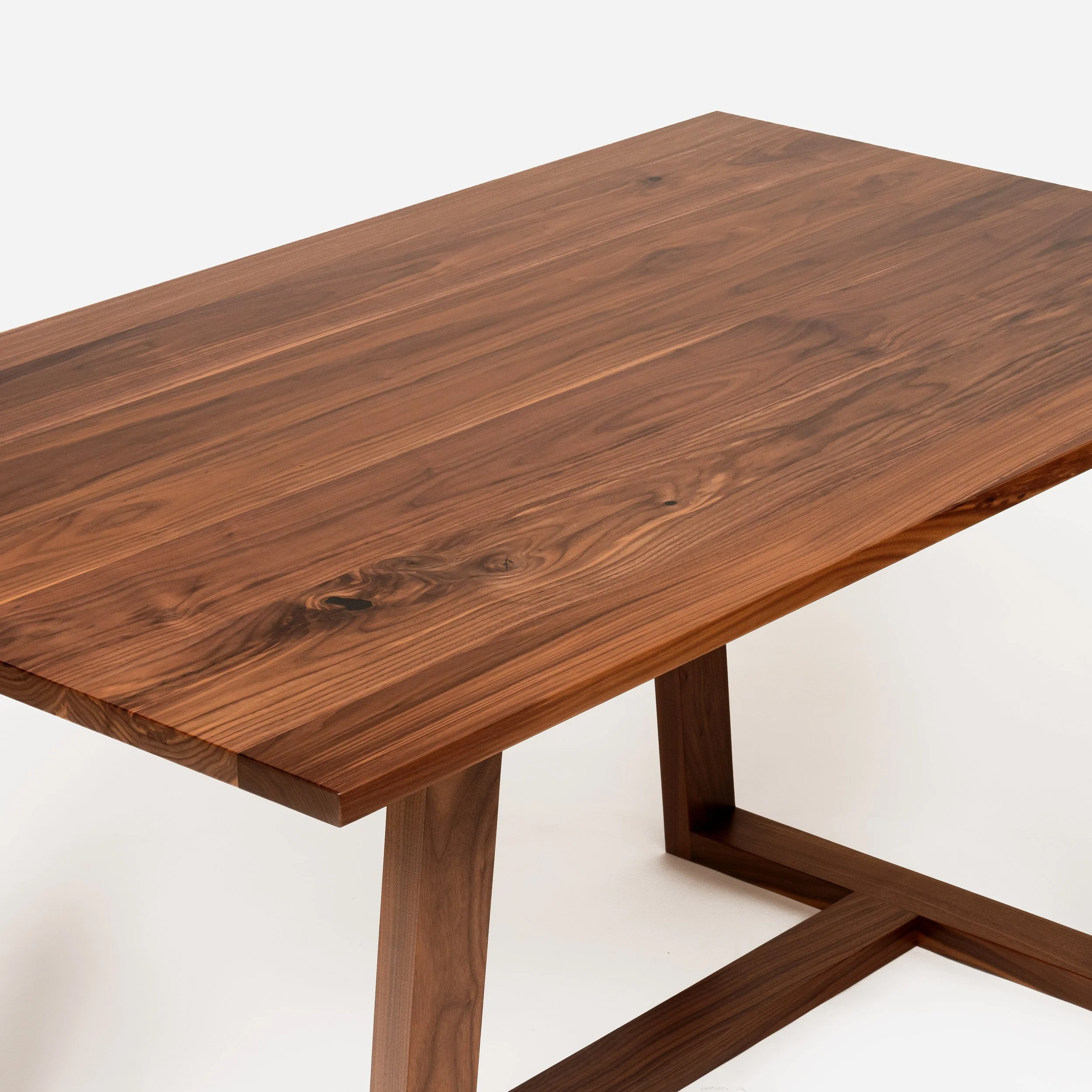 Handcrafted Arden Table made from walnut wood with tapered base, modern design, and expert craftsmanship, blending strength and elegance, made in Milwaukee.
