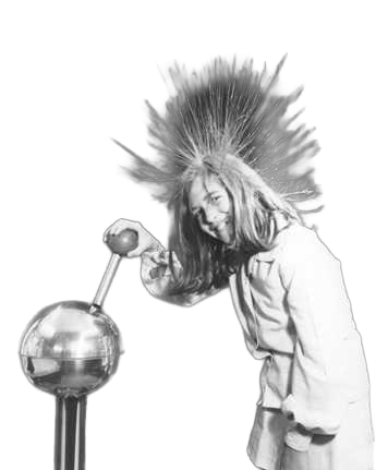 A girl (Blount) with hair standing up, holding a metal rod near a Van de Graff generator.