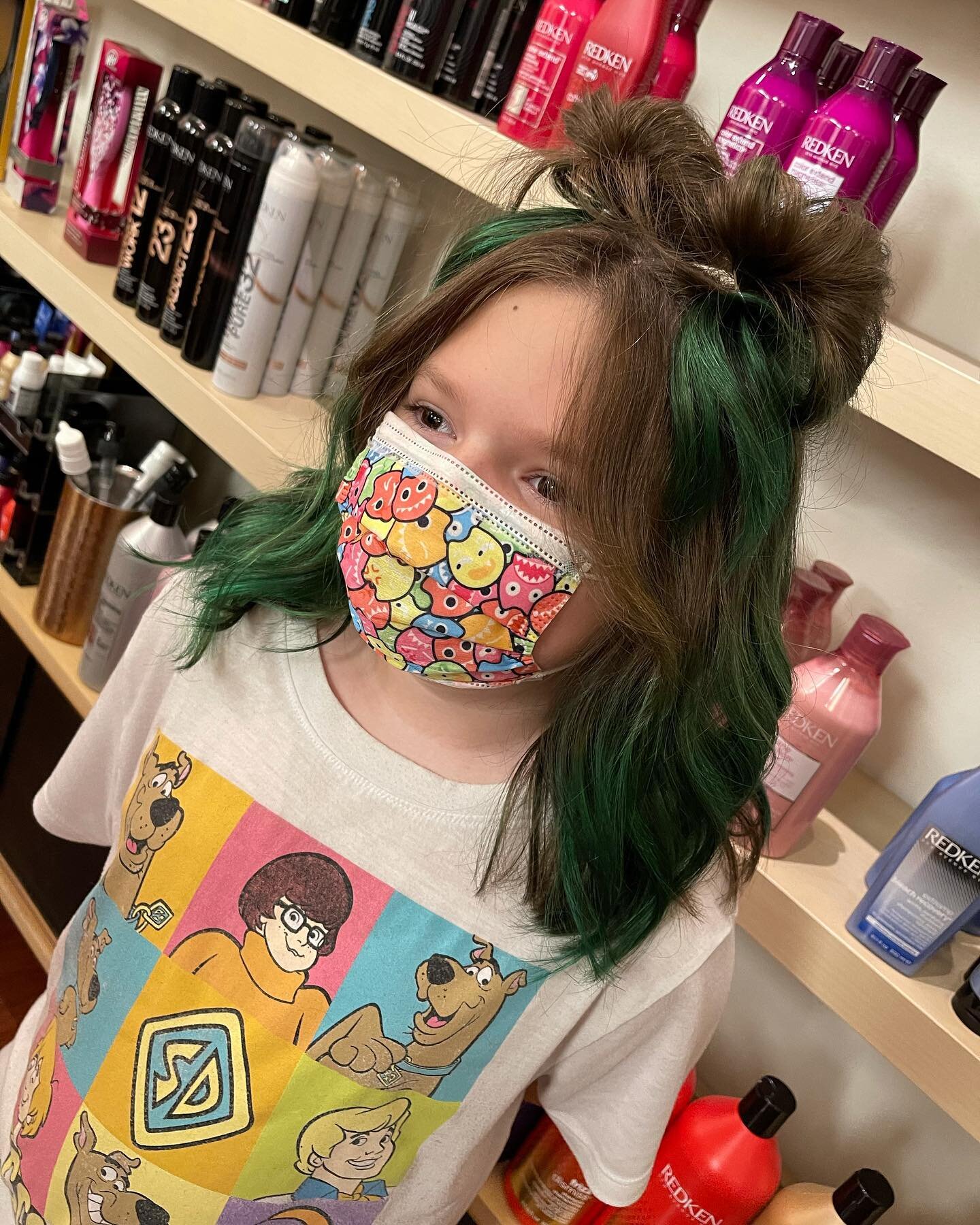 My youngest client, keeping me on my toes always! Space buns 👽 , Curtain Bangs 💥 &amp;&amp; Green Balayage ☘️ stylist : @hairbyhaleya