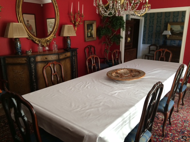 The White Table Cloth Ready To Be Signed (This is where we will eat, however image 4 highchairs, and two more chairs with booster seats.).