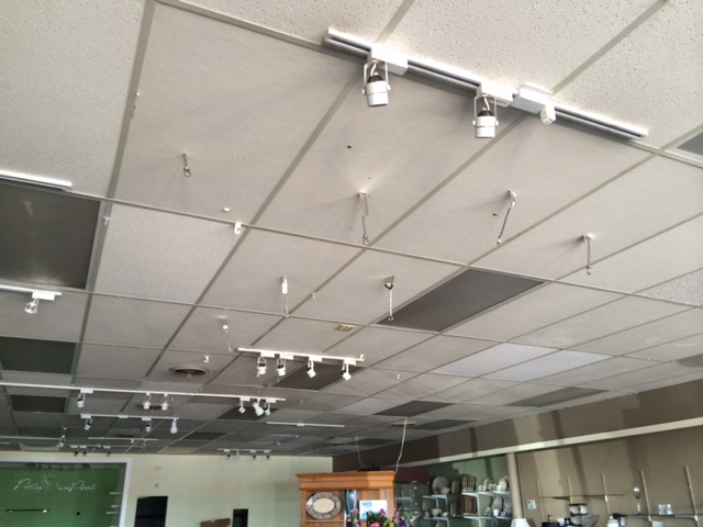 Spatula and knives stuck in the ceiling at the old Polly DuPont store.