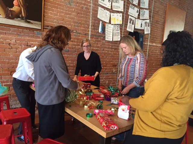 Wrapping presents for RSG's Adopt a Family.