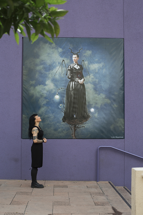 Liz Huston with her mural, "Creative Isolation and the Map of Authenticity" March 4, 2016 || Photo by TanyaAlexisPhoto.com