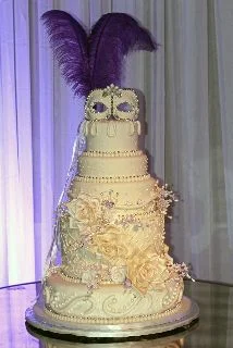 How about a wedding cake with a mask as a topper?