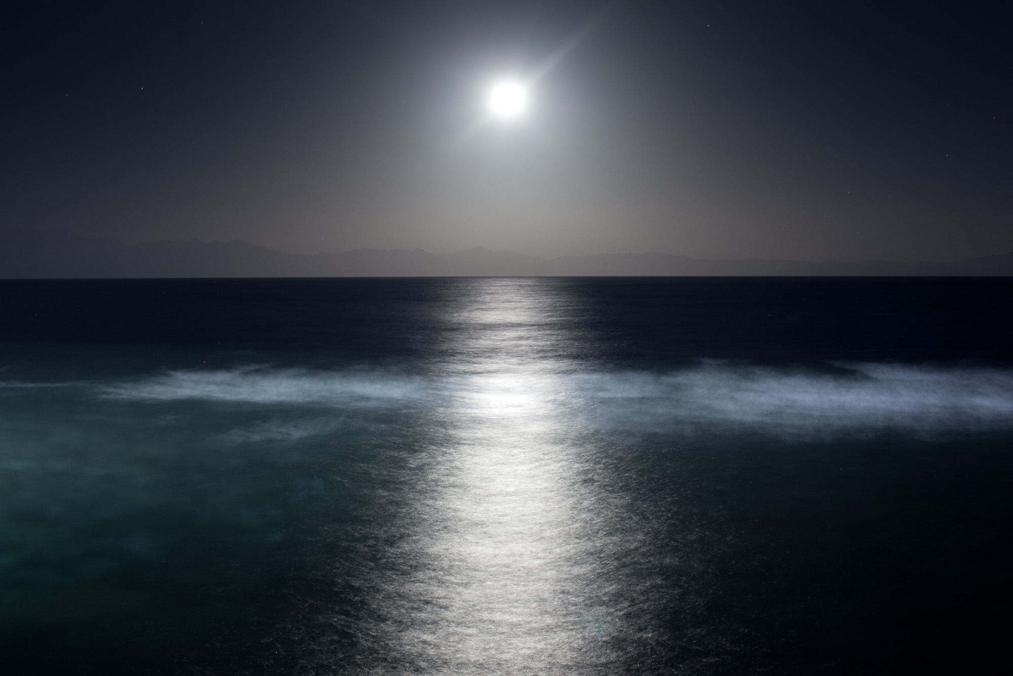 A moon shines over the bay of Aqaba between Egypt's Sinai peninsula and Saudi-Arabia.